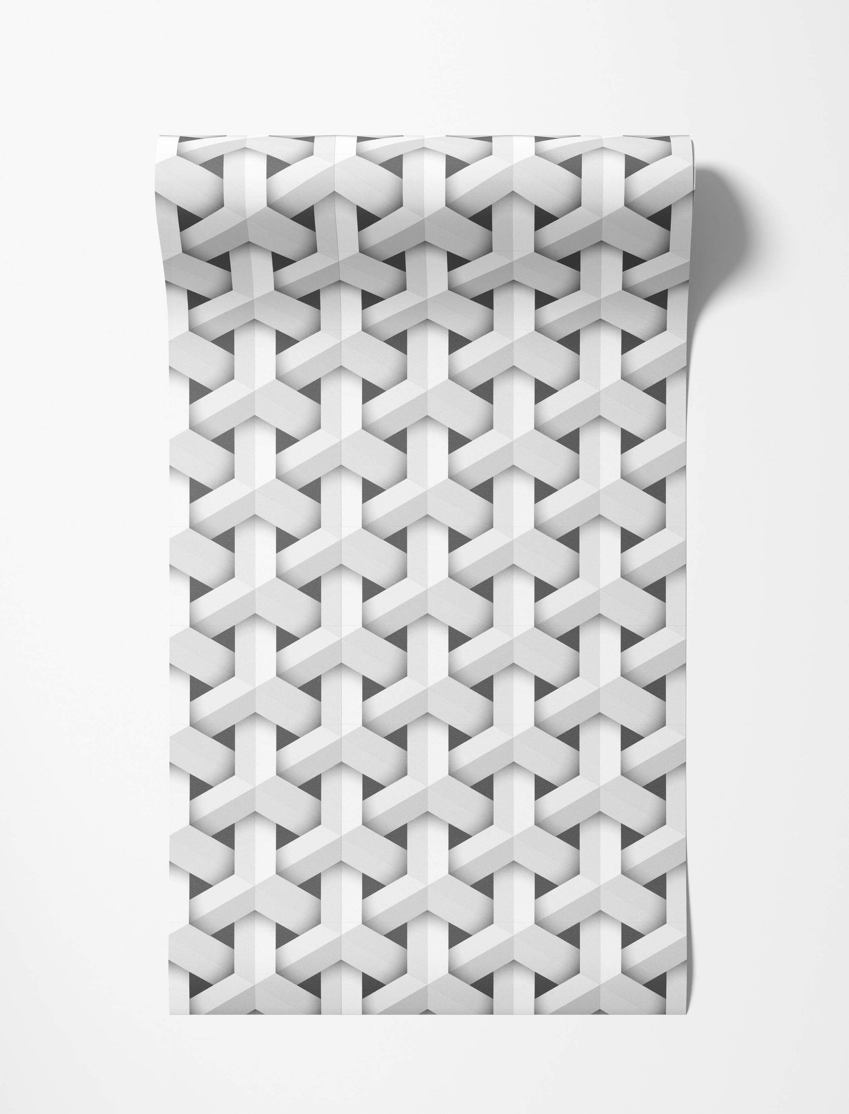 Geometric wallpaper with a repeating 3D pattern of interlocking white Y-shapes on a gray background.