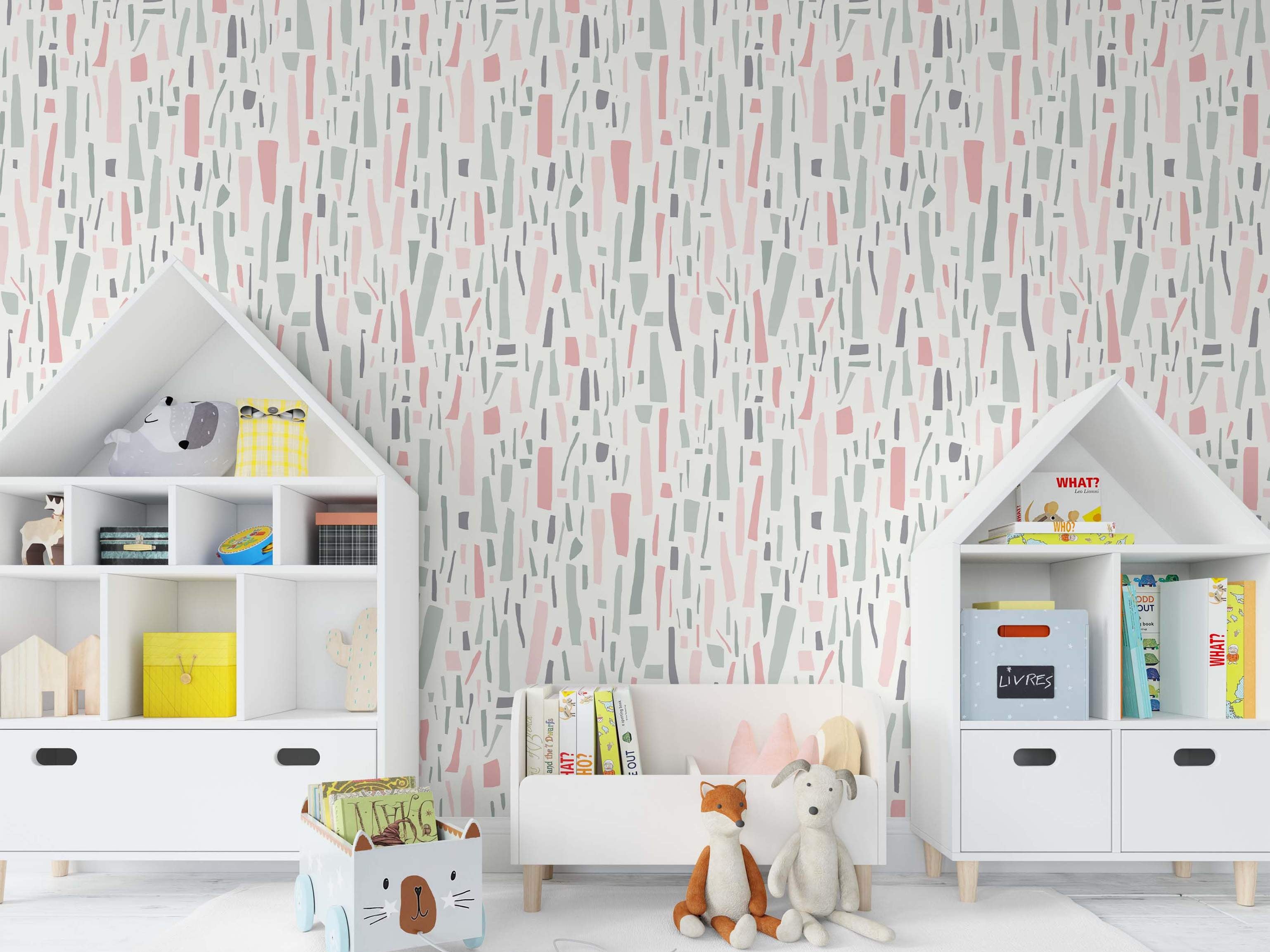 Abstract wallpaper featuring scattered irregular vertical fragments in soft pink, sage green, and dark gray on an off-white background.