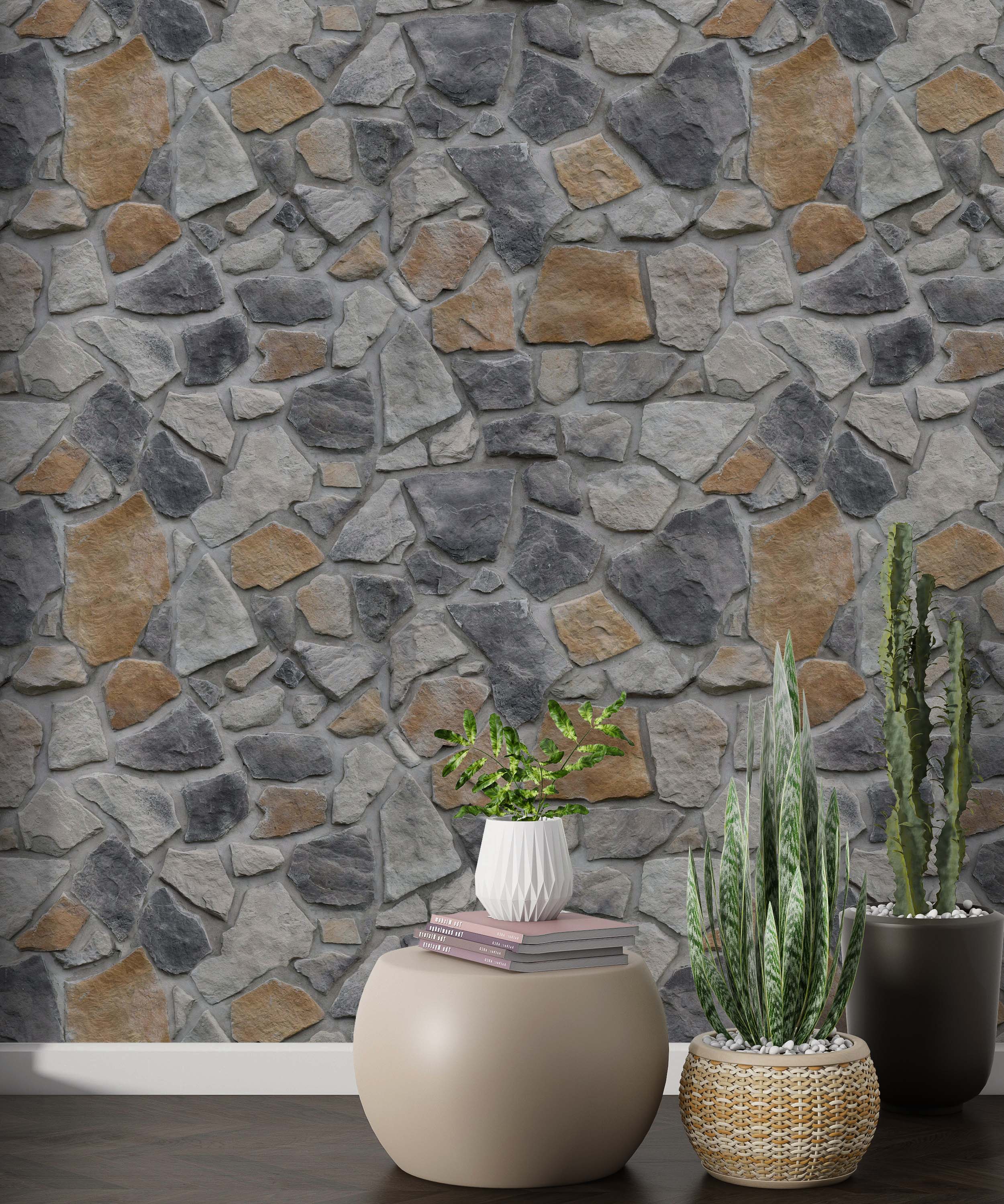 Wallpaper showcasing an irregular fieldstone pattern with stones in various shades of gray and earthy tan, creating a rustic look.