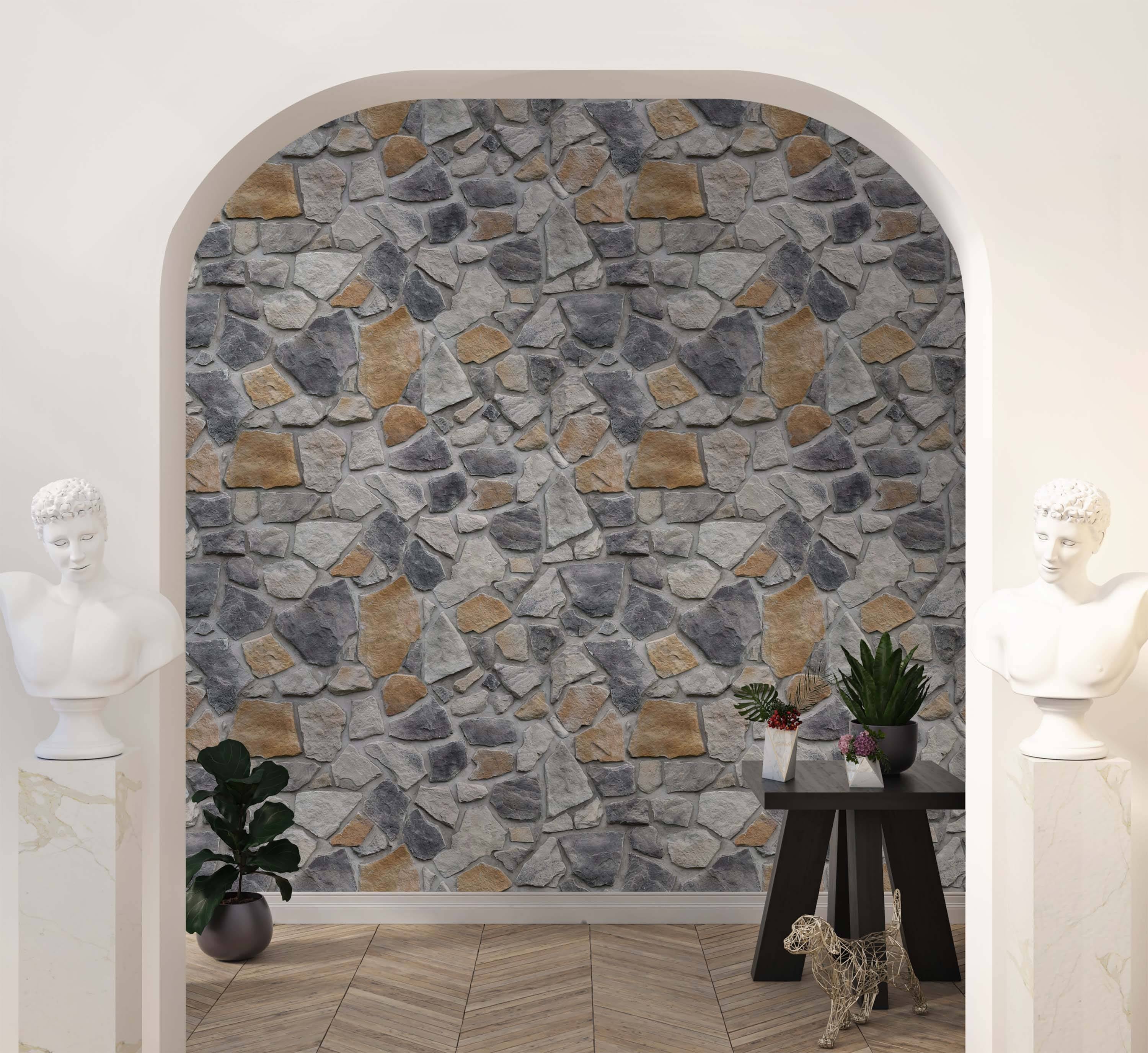 Wallpaper with a realistic pattern of irregularly shaped gray and tan stones.