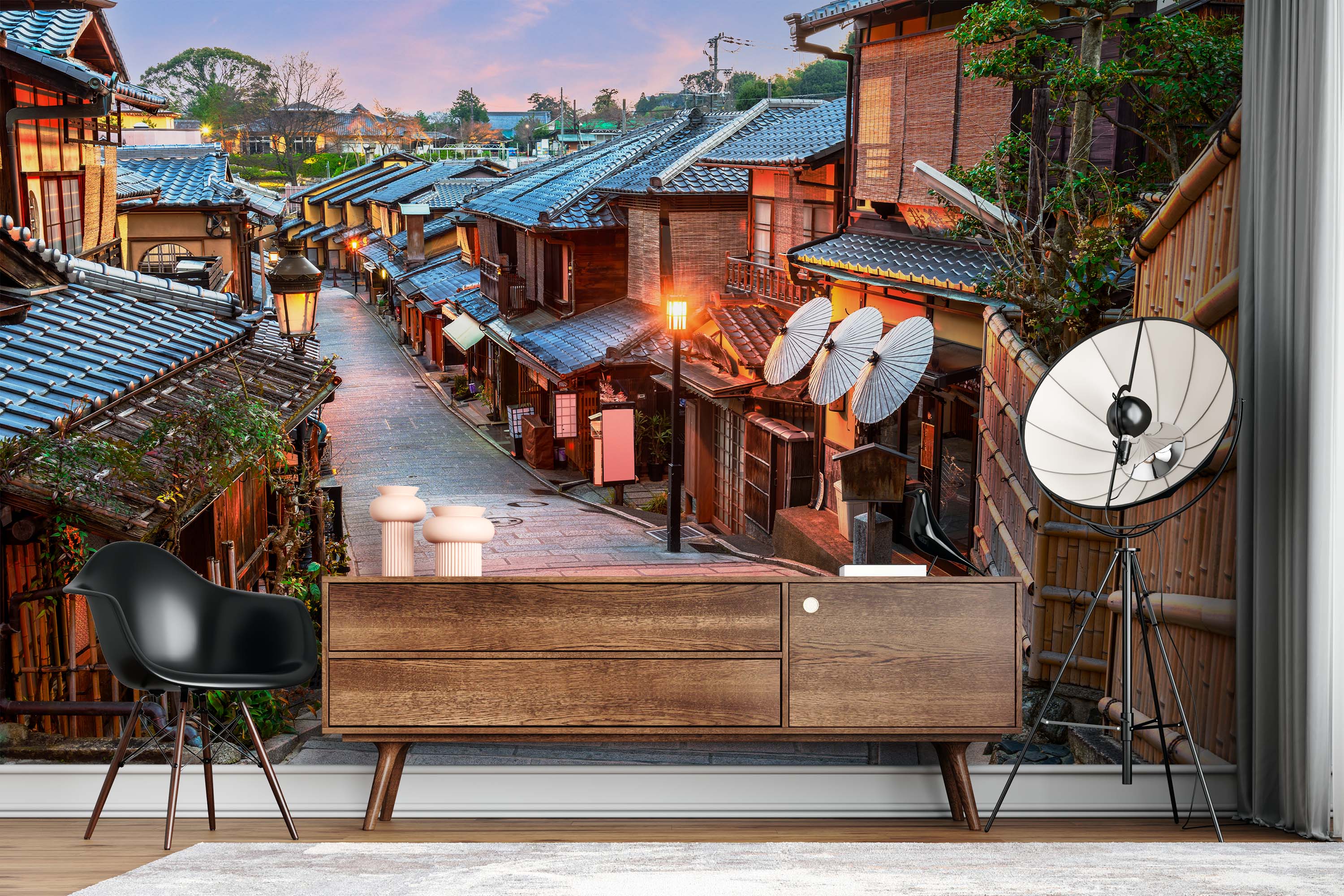 Mural of a traditional Japanese street in Kyoto at twilight, featuring wooden buildings with tiled roofs and glowing street lamps.