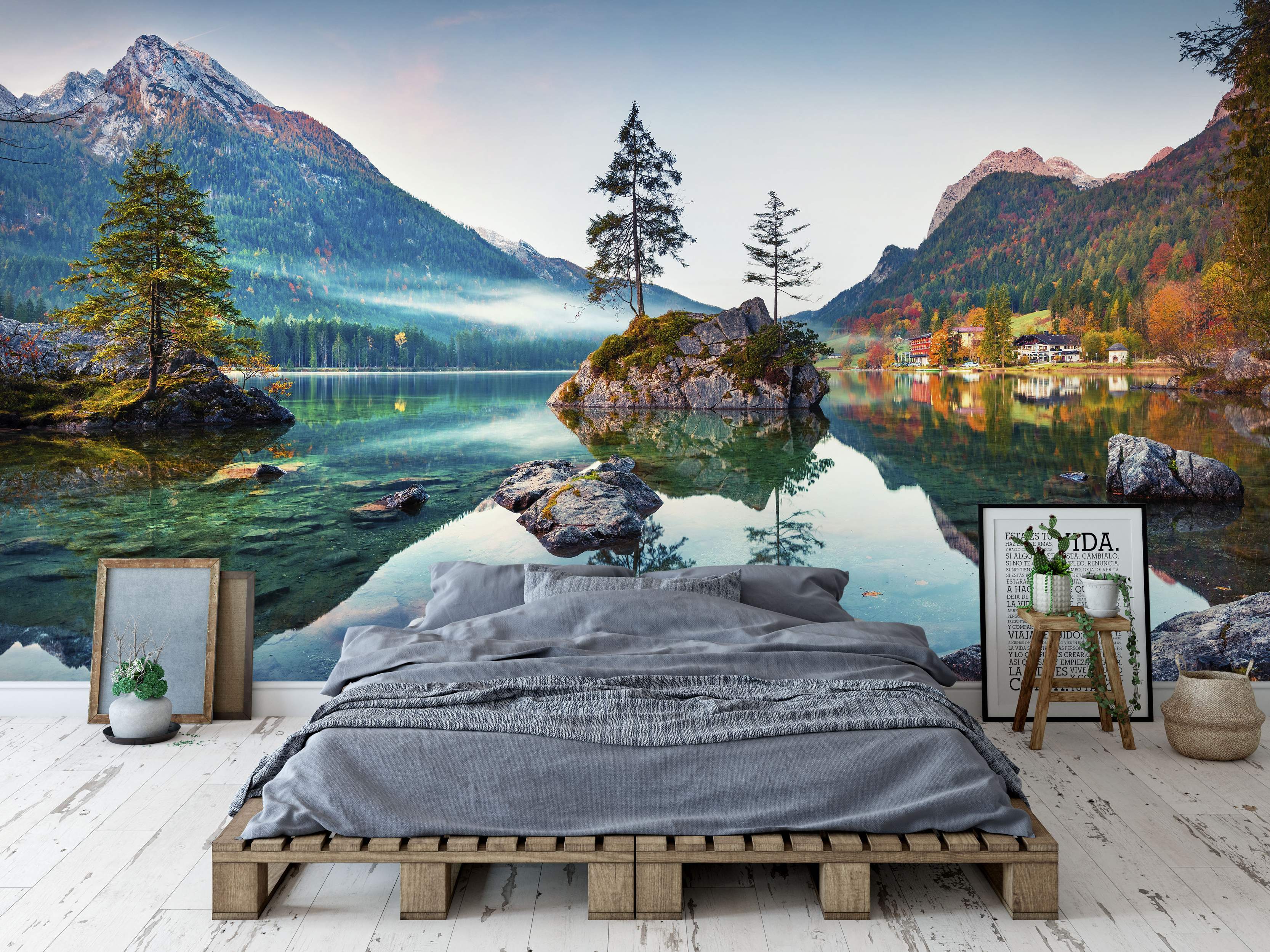 Mural depicting a clear blue-green alpine lake with a tree-covered island reflecting autumn mountains.