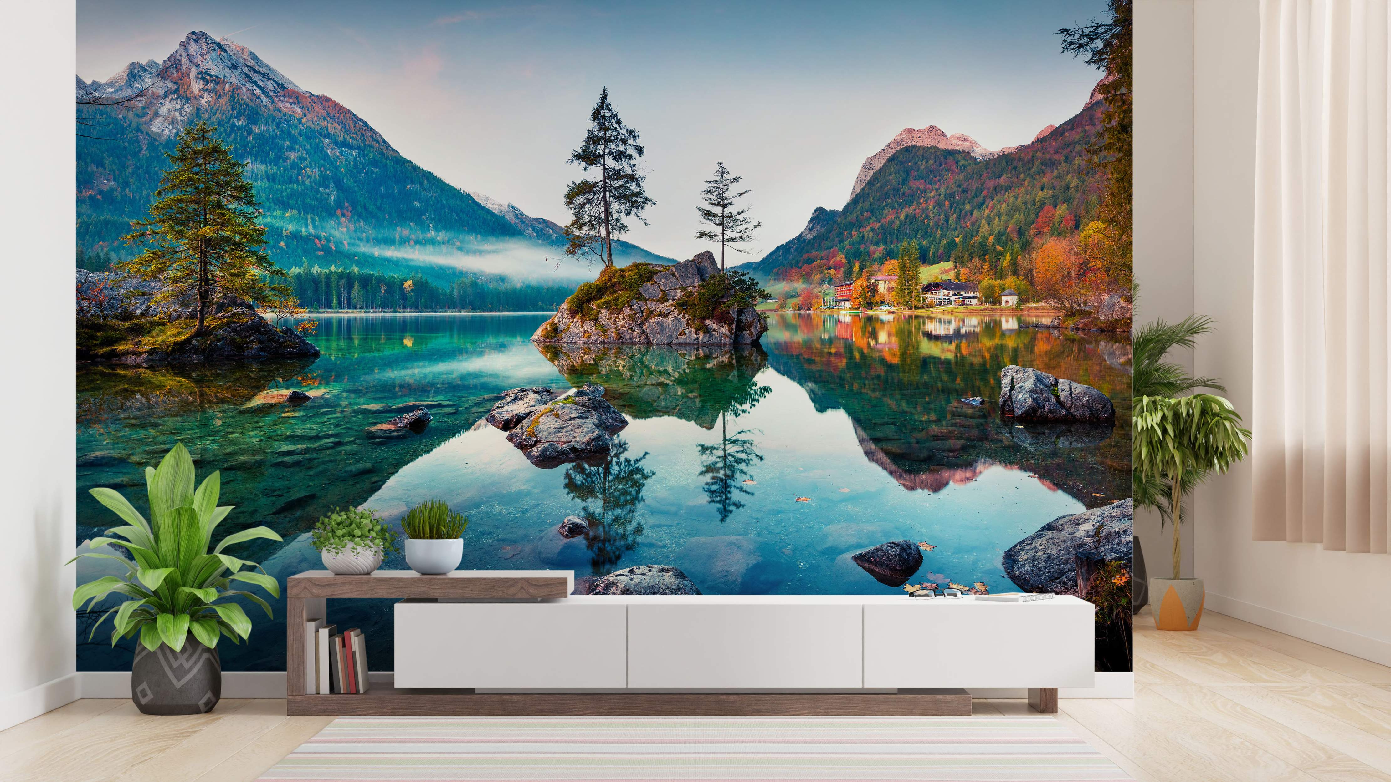 Mural featuring a calm mountain lake reflecting autumn trees and peaks under a blue sky, with clear turquoise water.