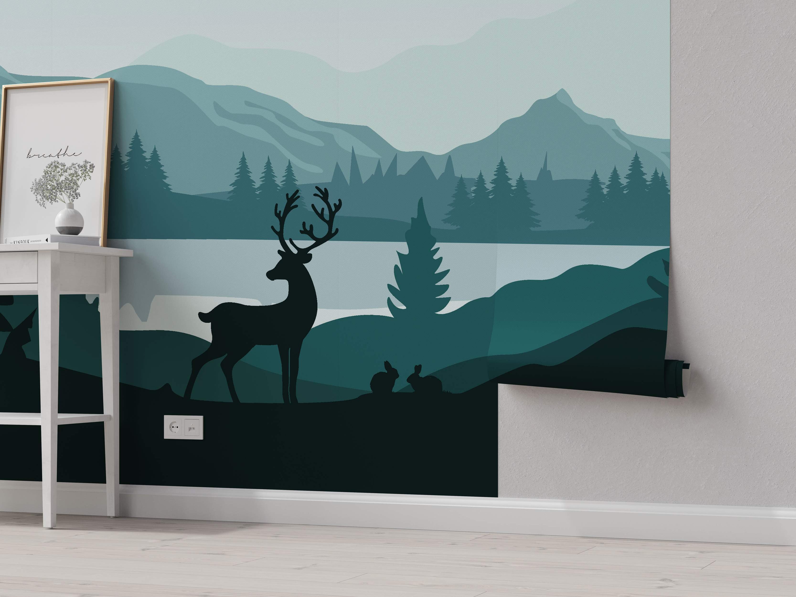 Minimalist landscape mural featuring layered silhouettes of mountains, trees, a lake, deer, and rabbits in shades of teal and blue-green.