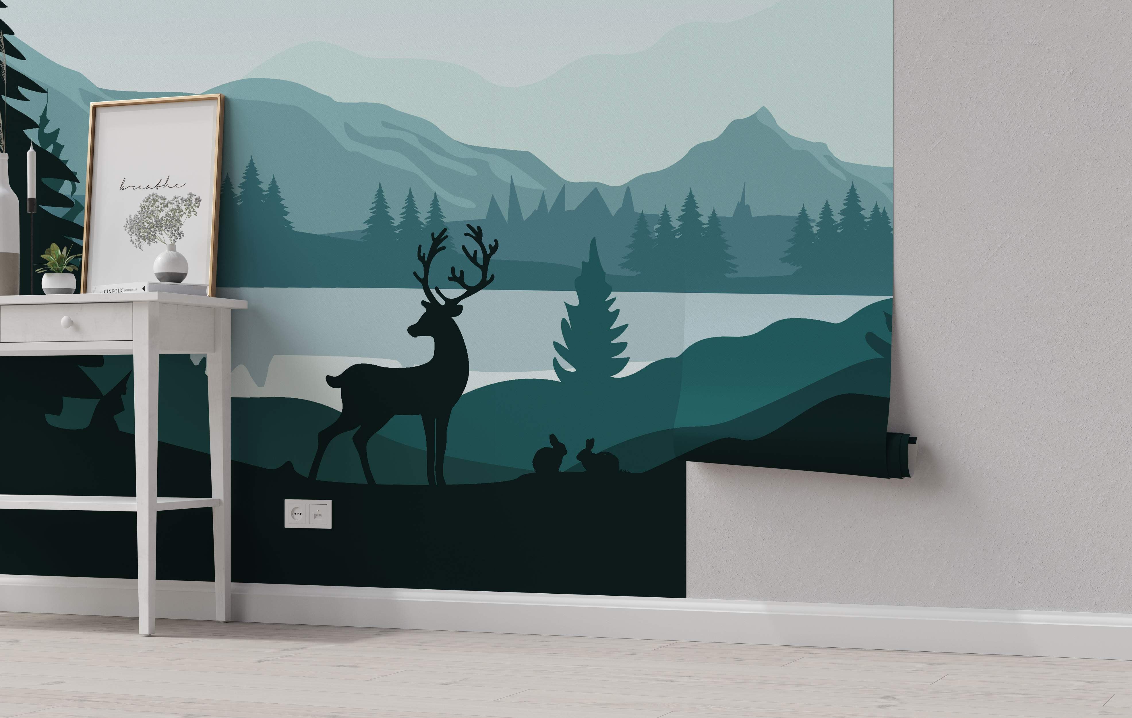 Minimalist landscape mural featuring layered silhouettes of mountains, trees, a lake, deer, and rabbits in shades of teal and blue-green.