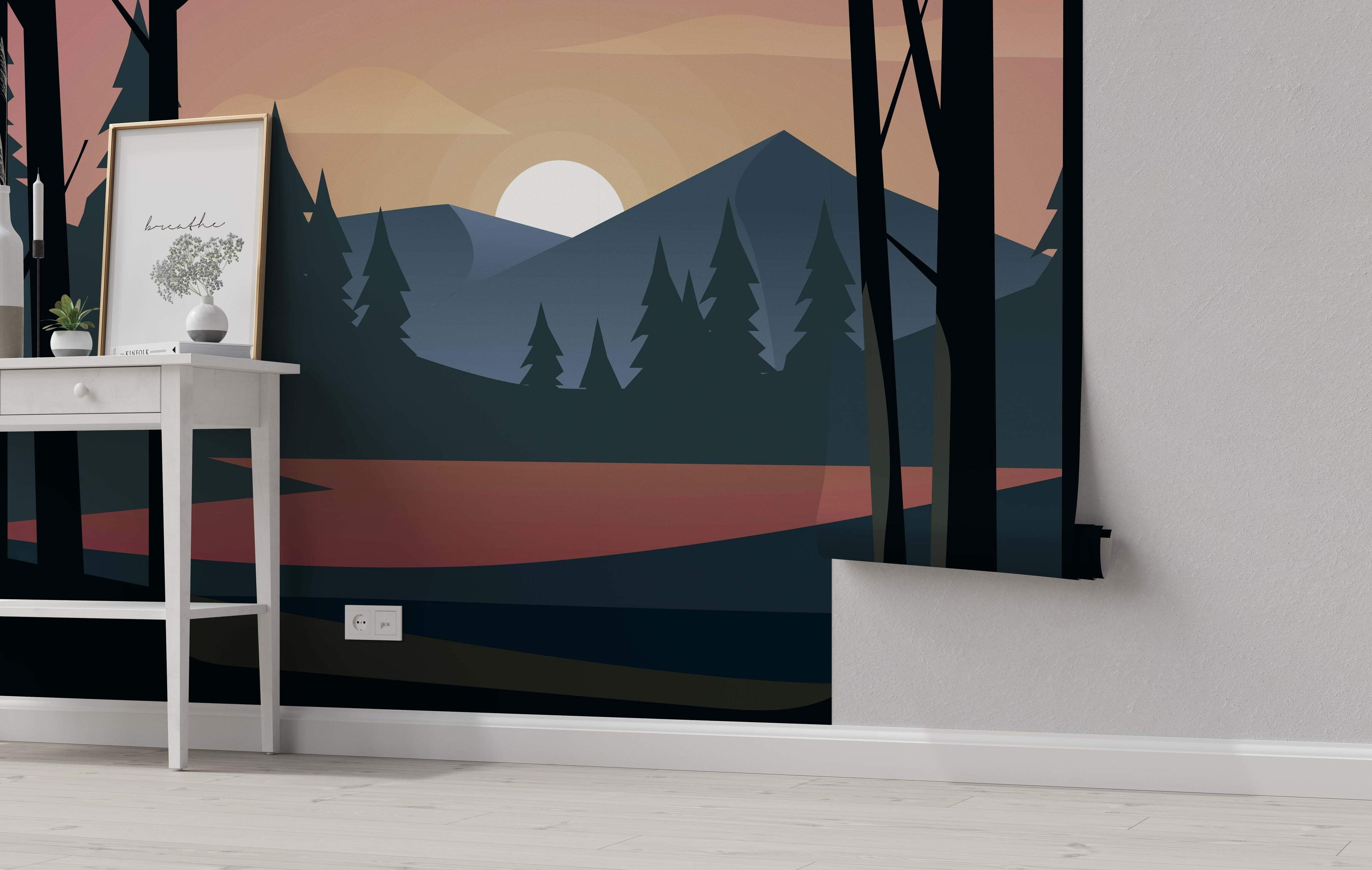 Stylized landscape mural featuring blue mountains, black forest silhouettes, and a pink/orange sunset reflected in water.