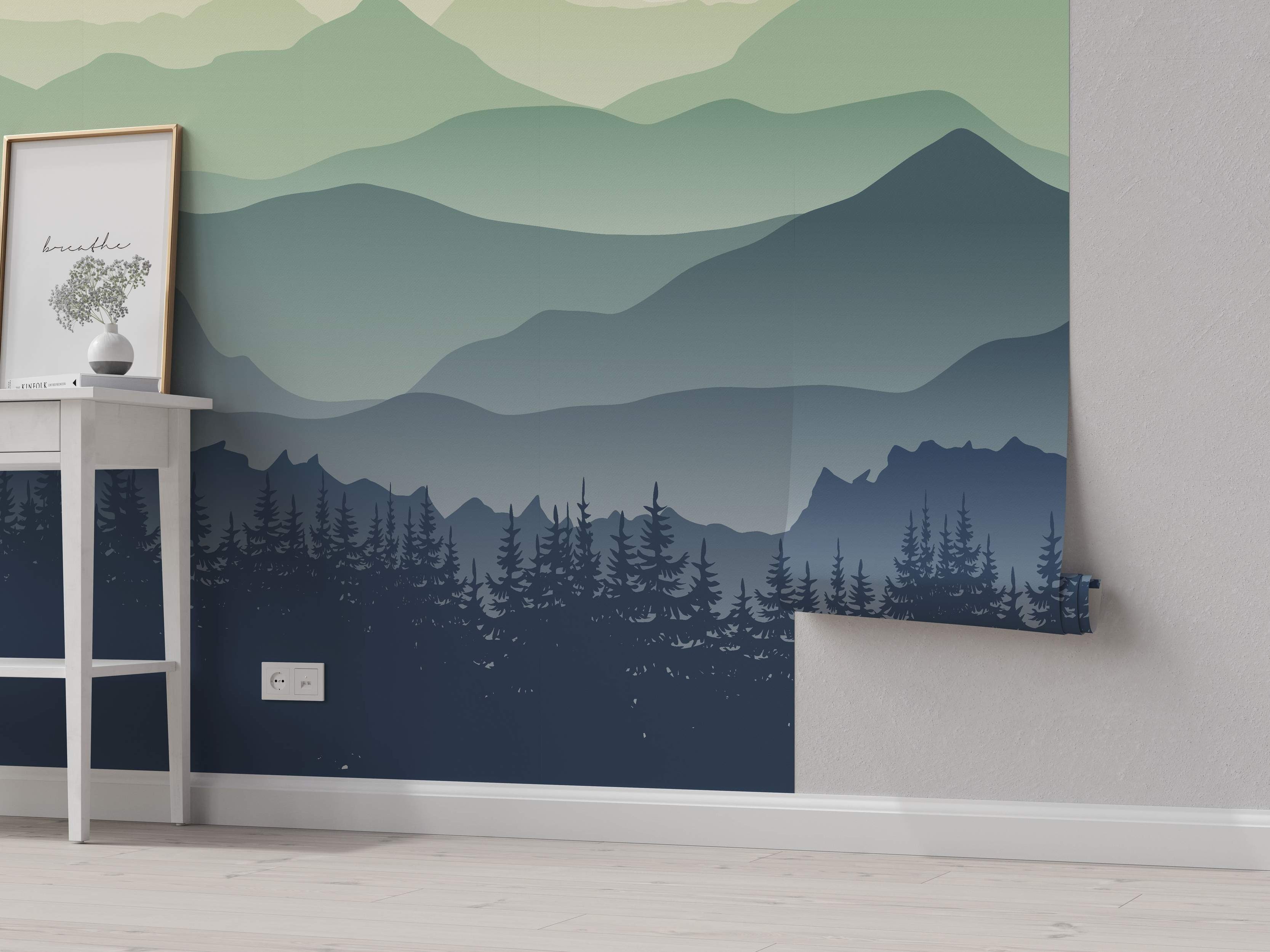 Mural depicting layered mountains in green and blue gradients above a dark blue pine tree forest silhouette.