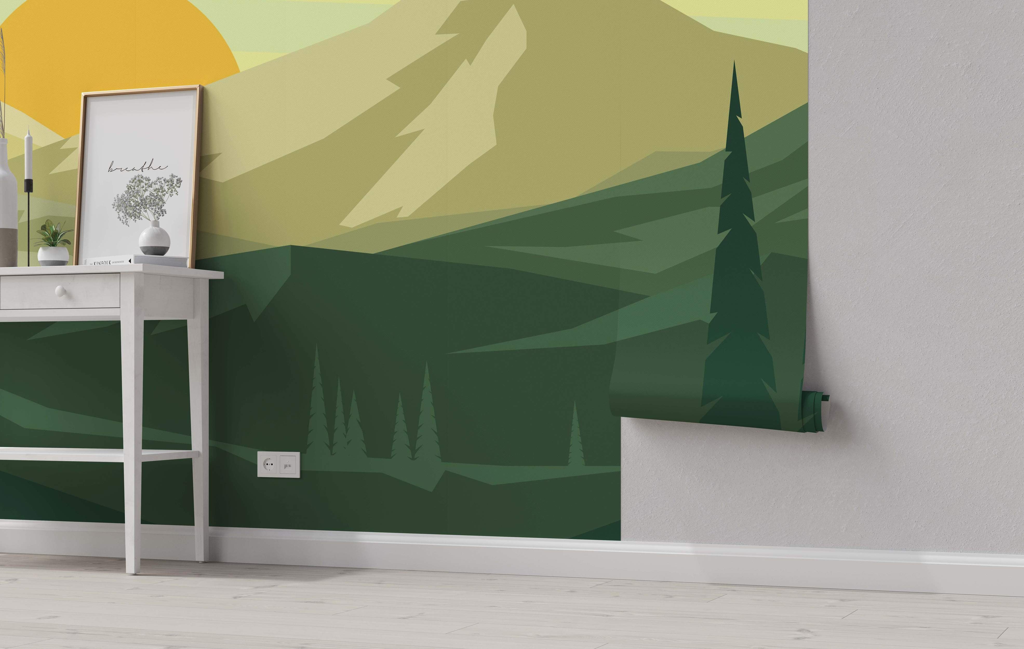 Minimalist landscape mural featuring geometric mountains and trees in shades of green under a large yellow sun.