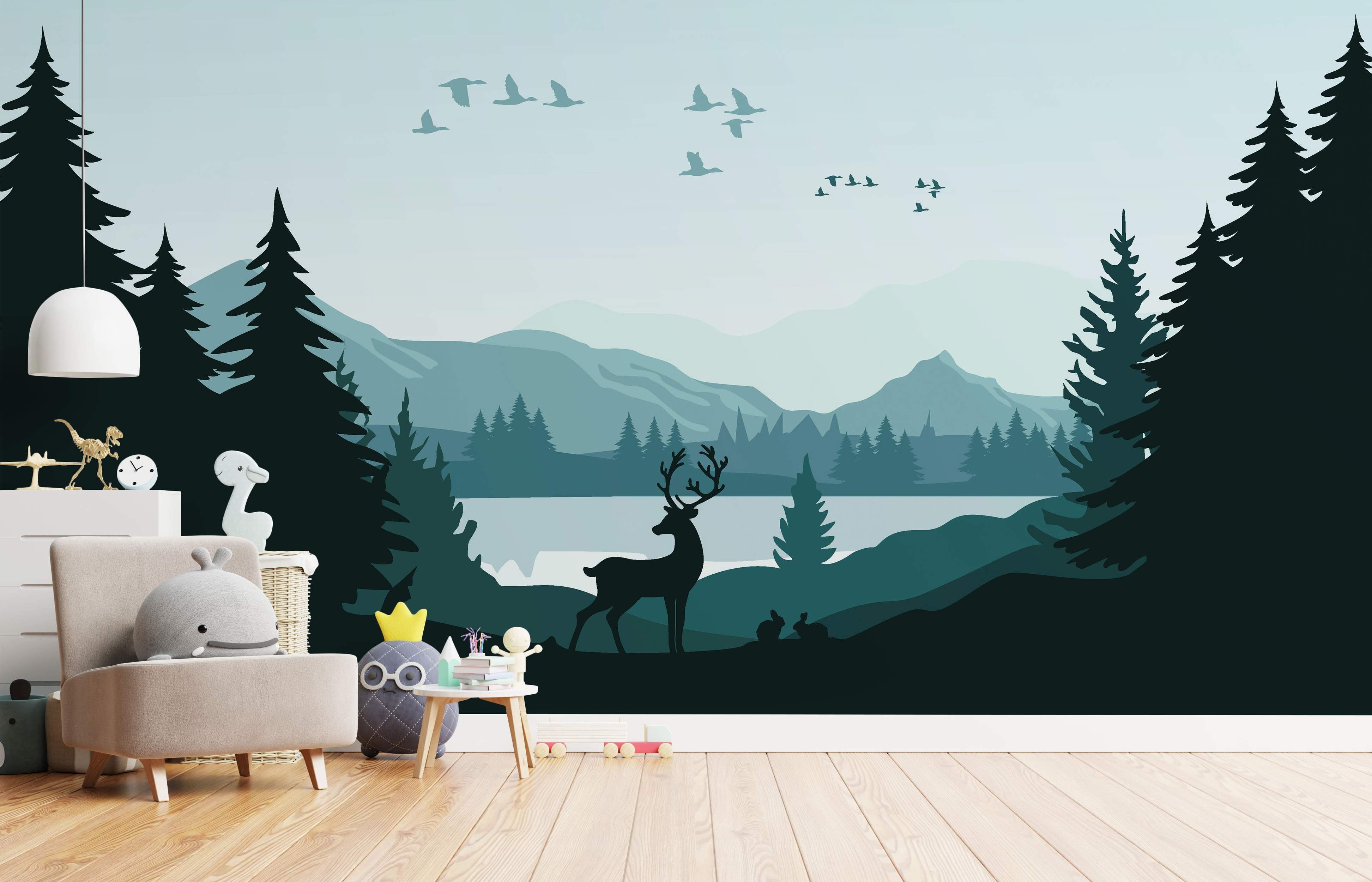 Silhouette landscape mural with layered teal mountains, lake, dark pine trees, deer, rabbits, and birds against a pale blue sky.
