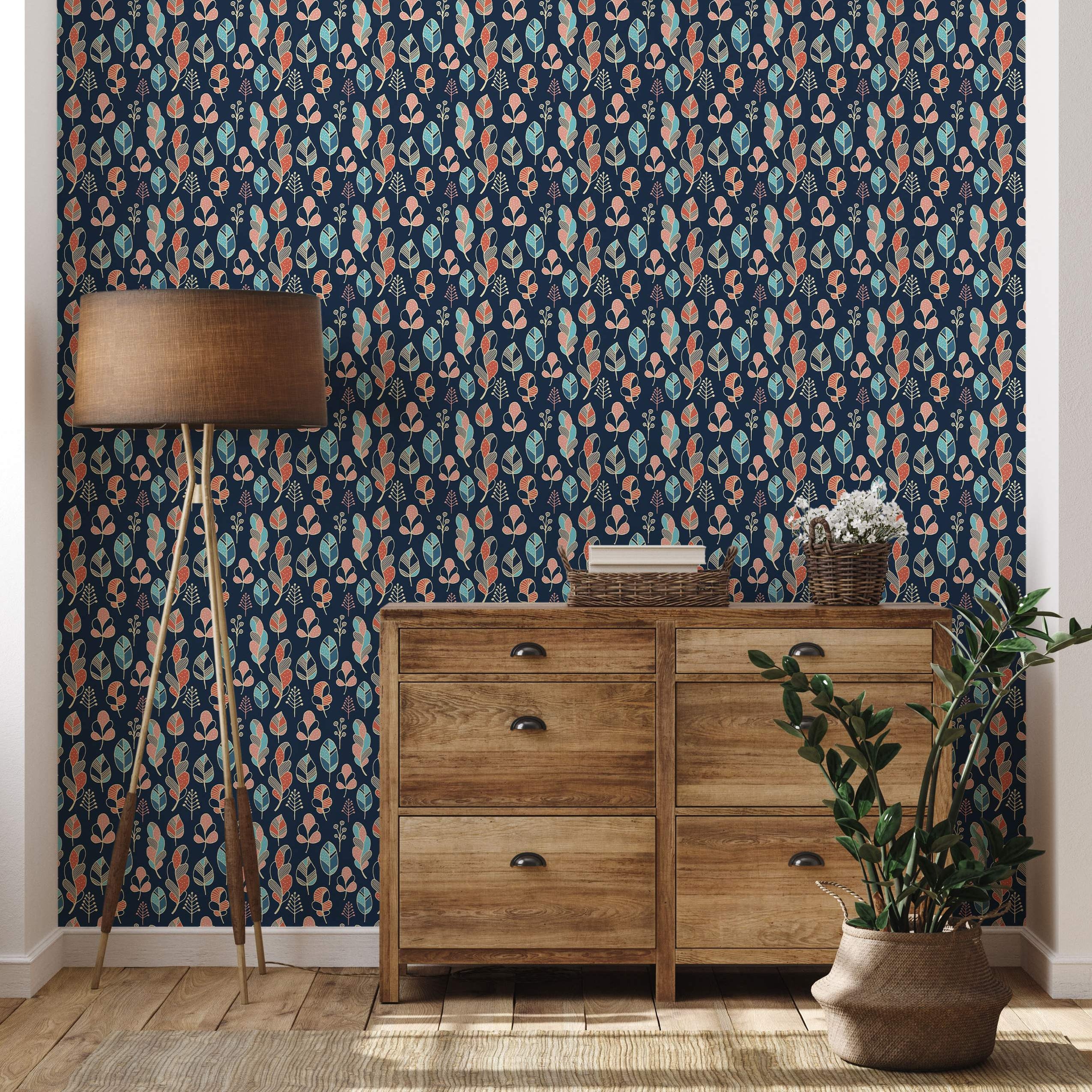 Stylized leaf and feather motif wallpaper in teal, orange, pink, and beige on a dark blue background.
