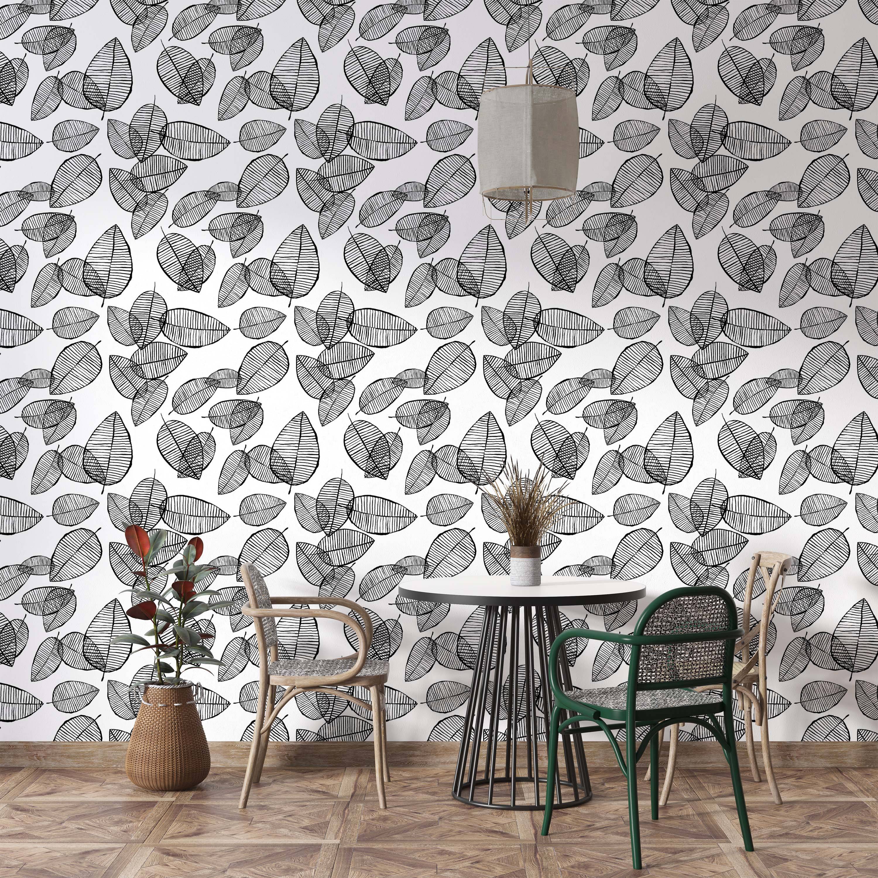 Wallpaper with a dense pattern of black outlined leaves, filled with horizontal lines, scattered across a white background.