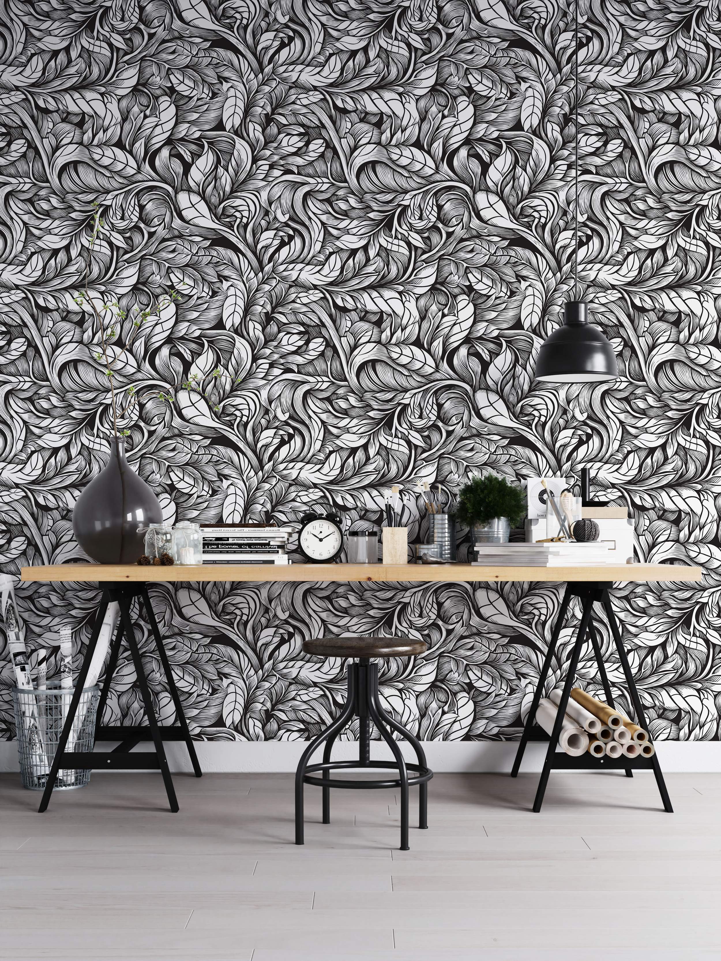 Intricate black and white wallpaper displaying a dense pattern of swirling, hand-drawn style leaves.