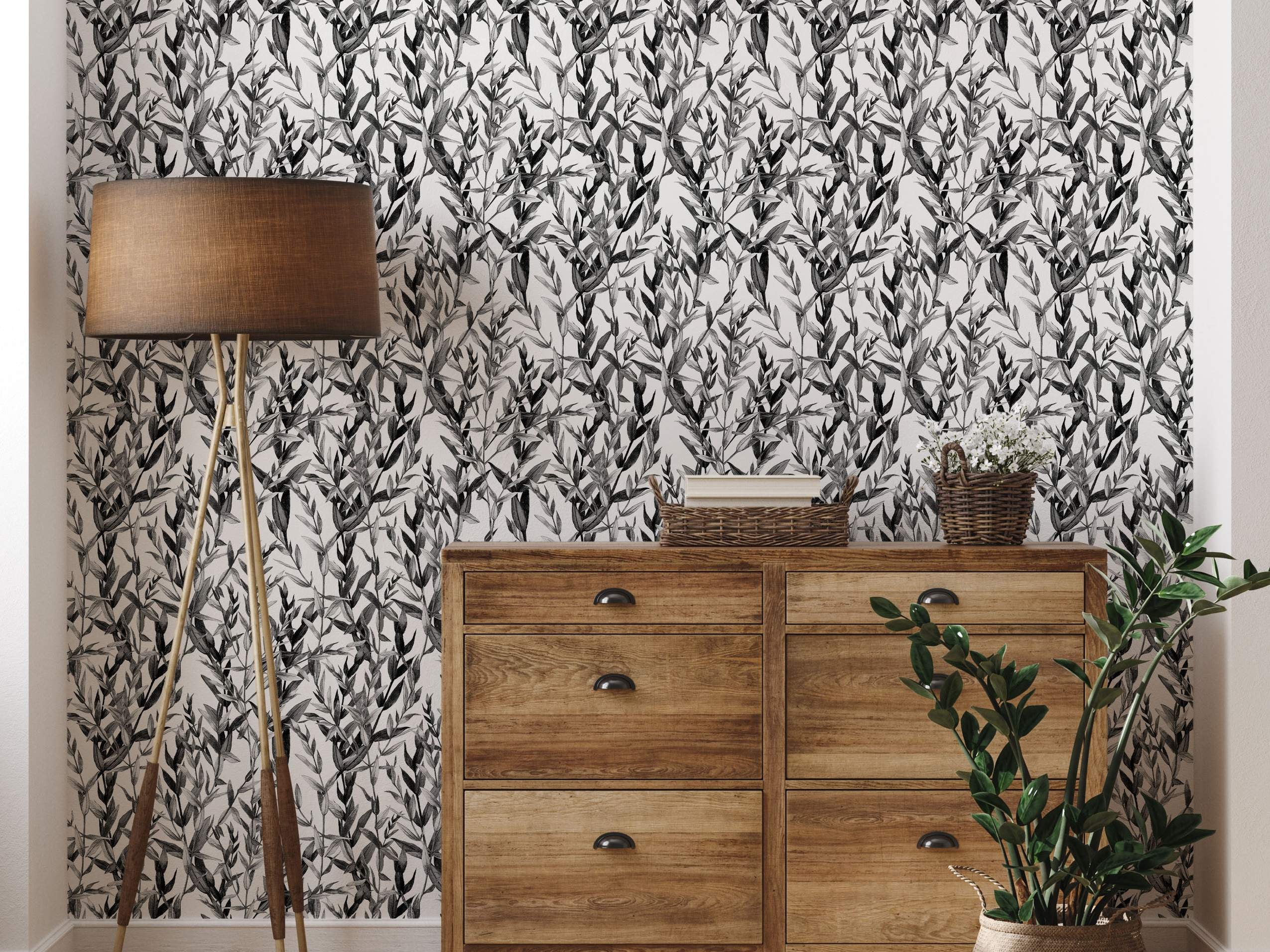 Illustrative wallpaper featuring a repeating dense pattern of sketched foliage leaves in black and grey on a white background.