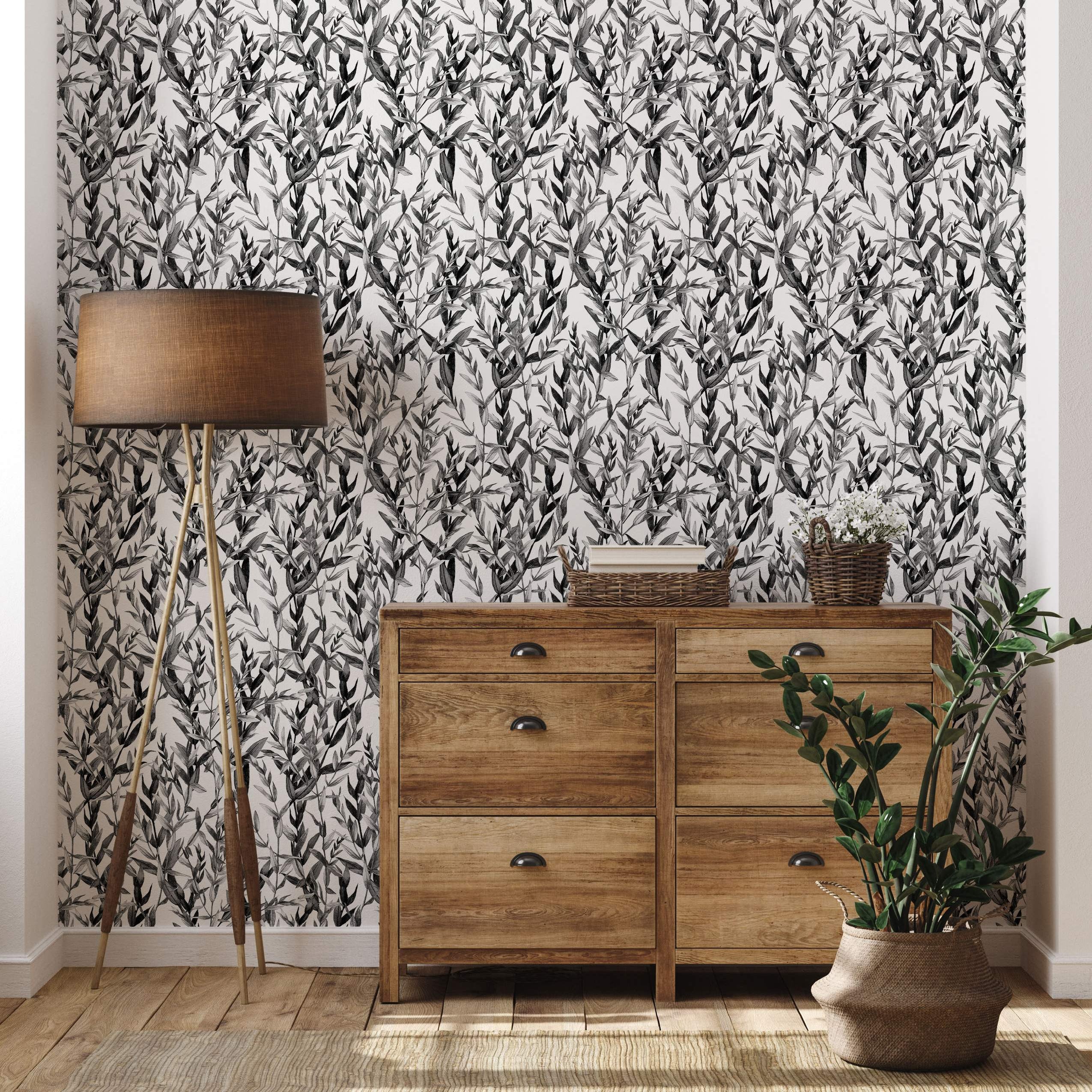 Illustrative wallpaper featuring a repeating dense pattern of sketched foliage leaves in black and grey on a white background.