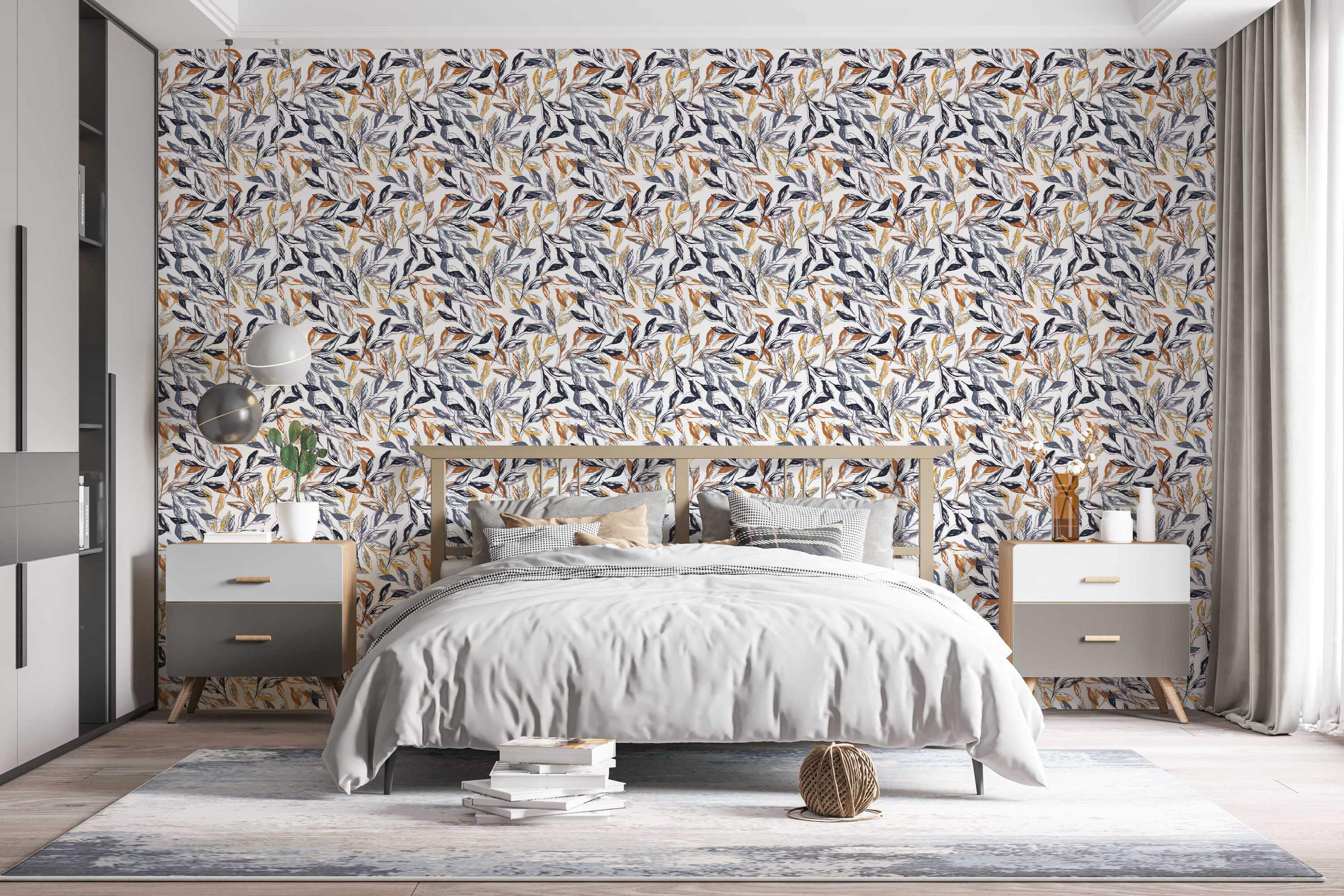 Sketchy botanical wallpaper with clusters of leaves in navy blue, grey, ochre yellow, and rust brown on a white background.