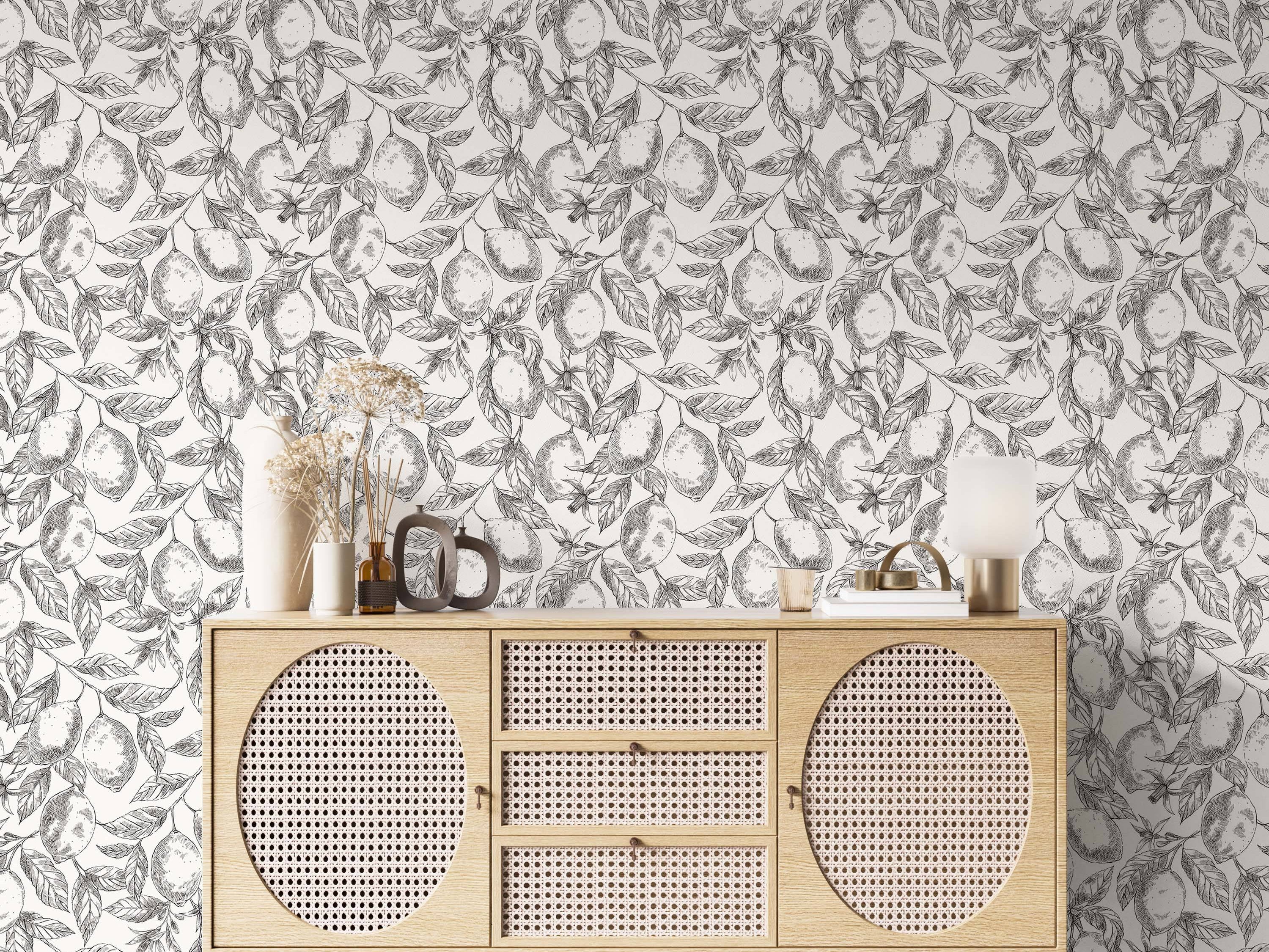 Black and white botanical wallpaper showcasing a hand-drawn sketch pattern of lemons and leaves.