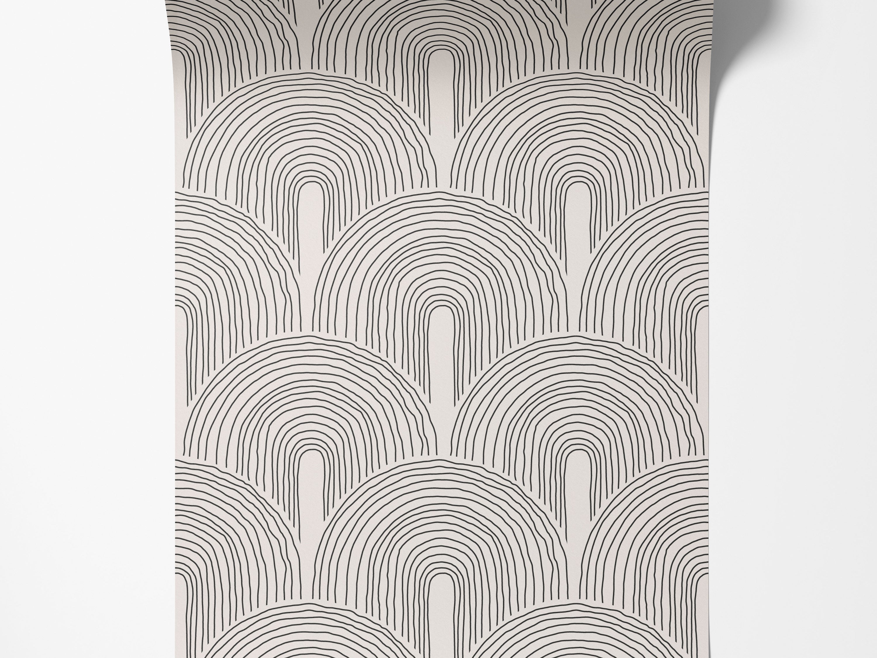 Wallpaper with a pattern of hand-drawn black nested U-shapes on a cream background, forming overlapping arches.