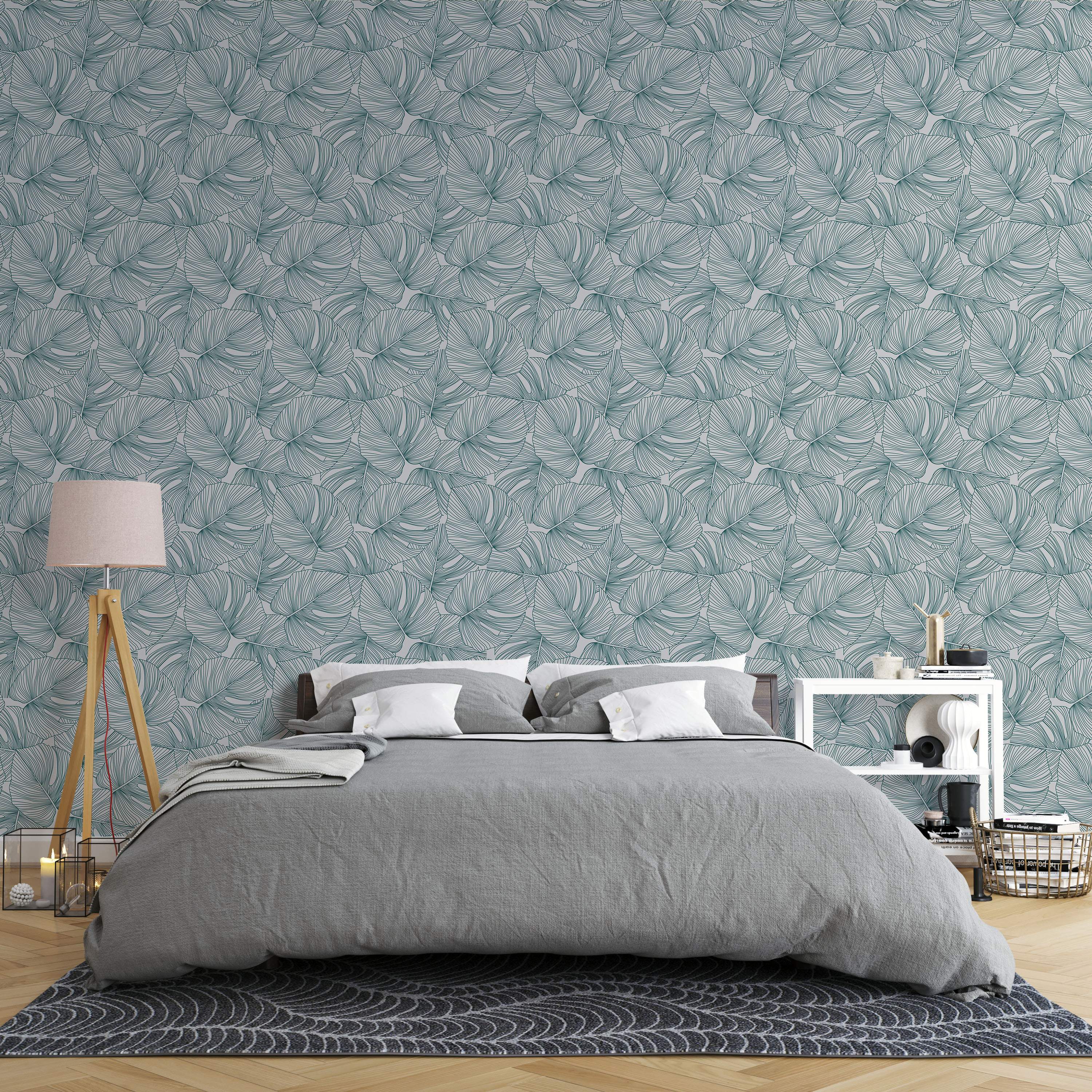 Wallpaper featuring a repeating pattern of overlapping, stylized teal green line art leaves on a light gray background.