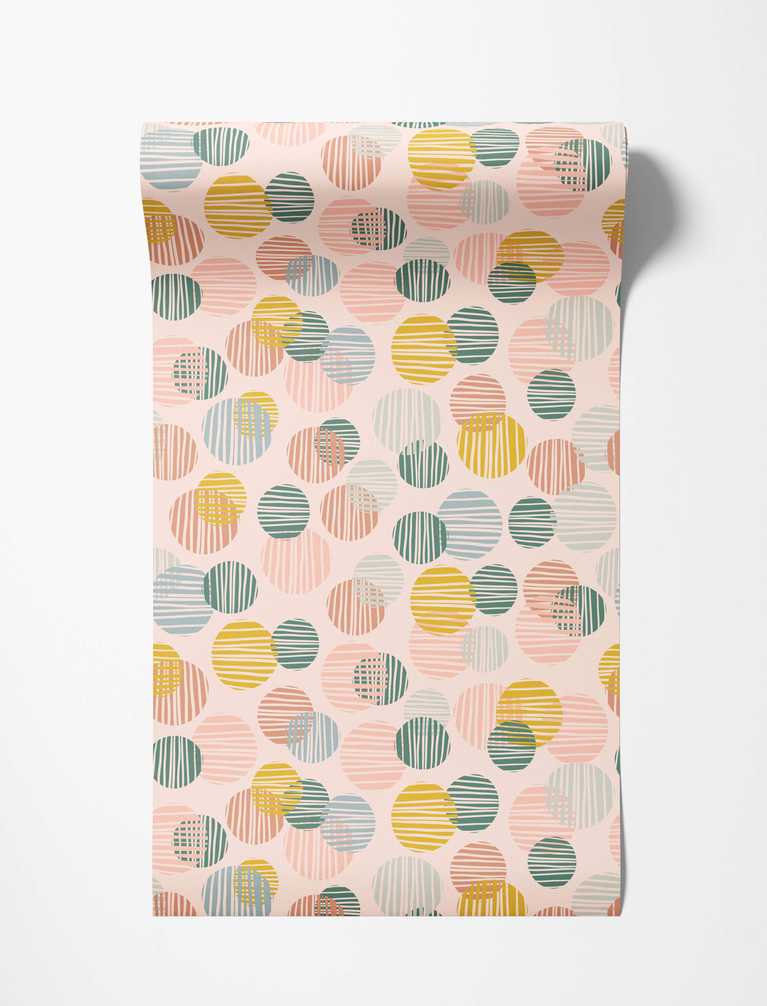 Wallpaper featuring overlapping circles in pastel pink, blue, green, and yellow, filled with varied line textures on a pale pink background.