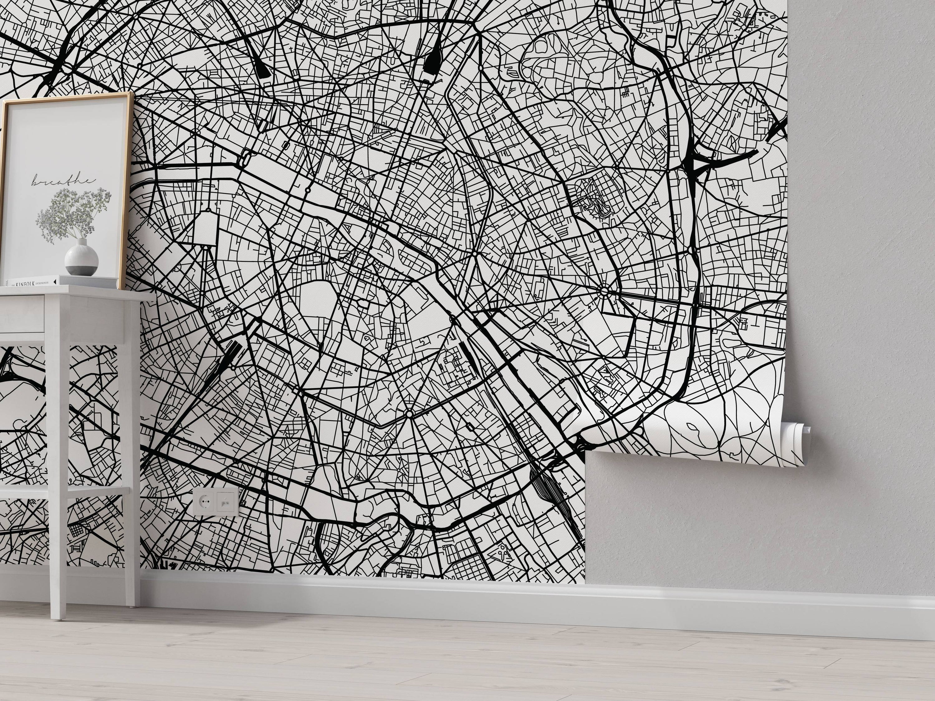 Black and white city map mural featuring intricate street layouts and geographical details.