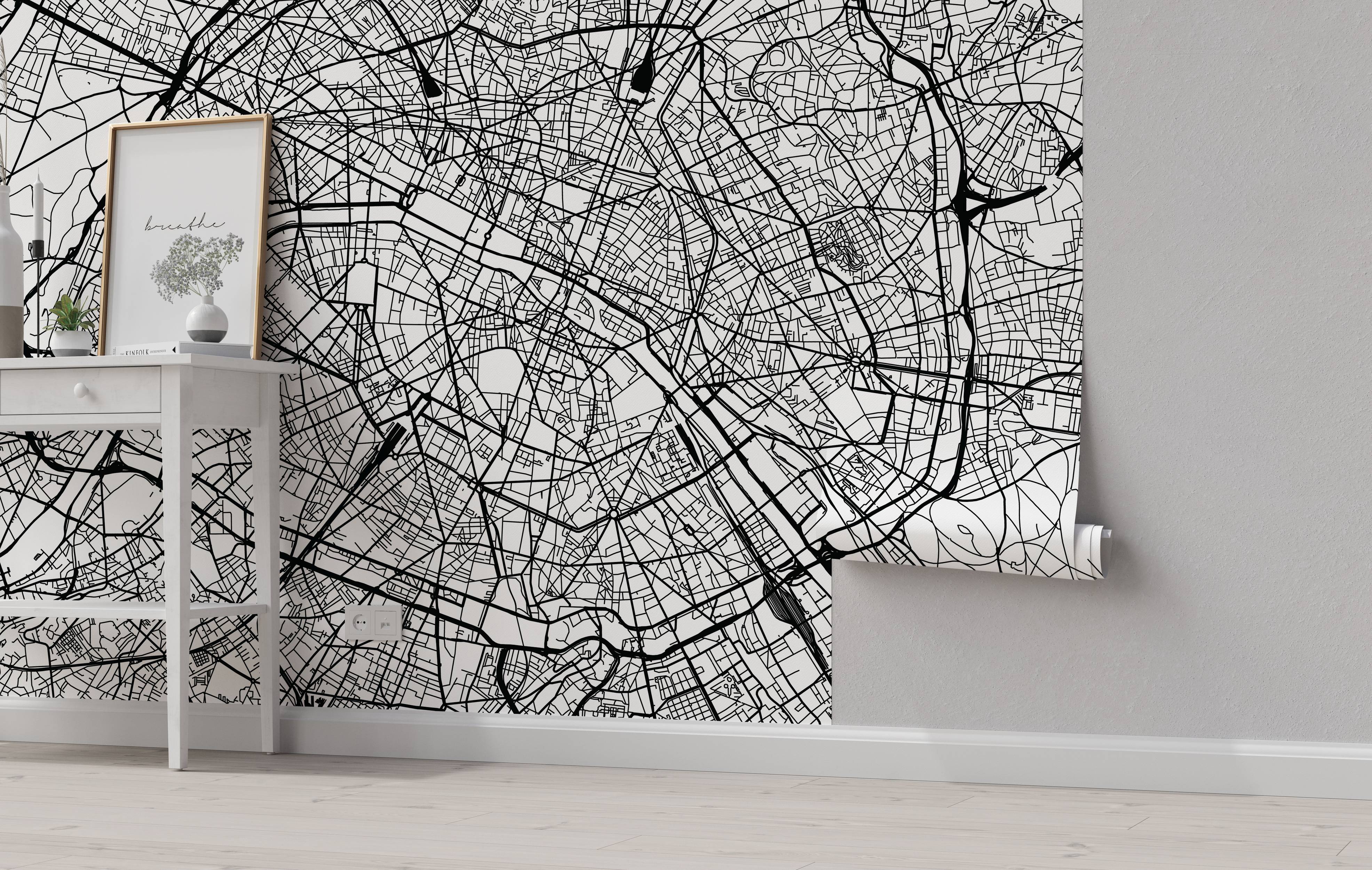 Black and white city map mural featuring intricate street layouts and geographical details.