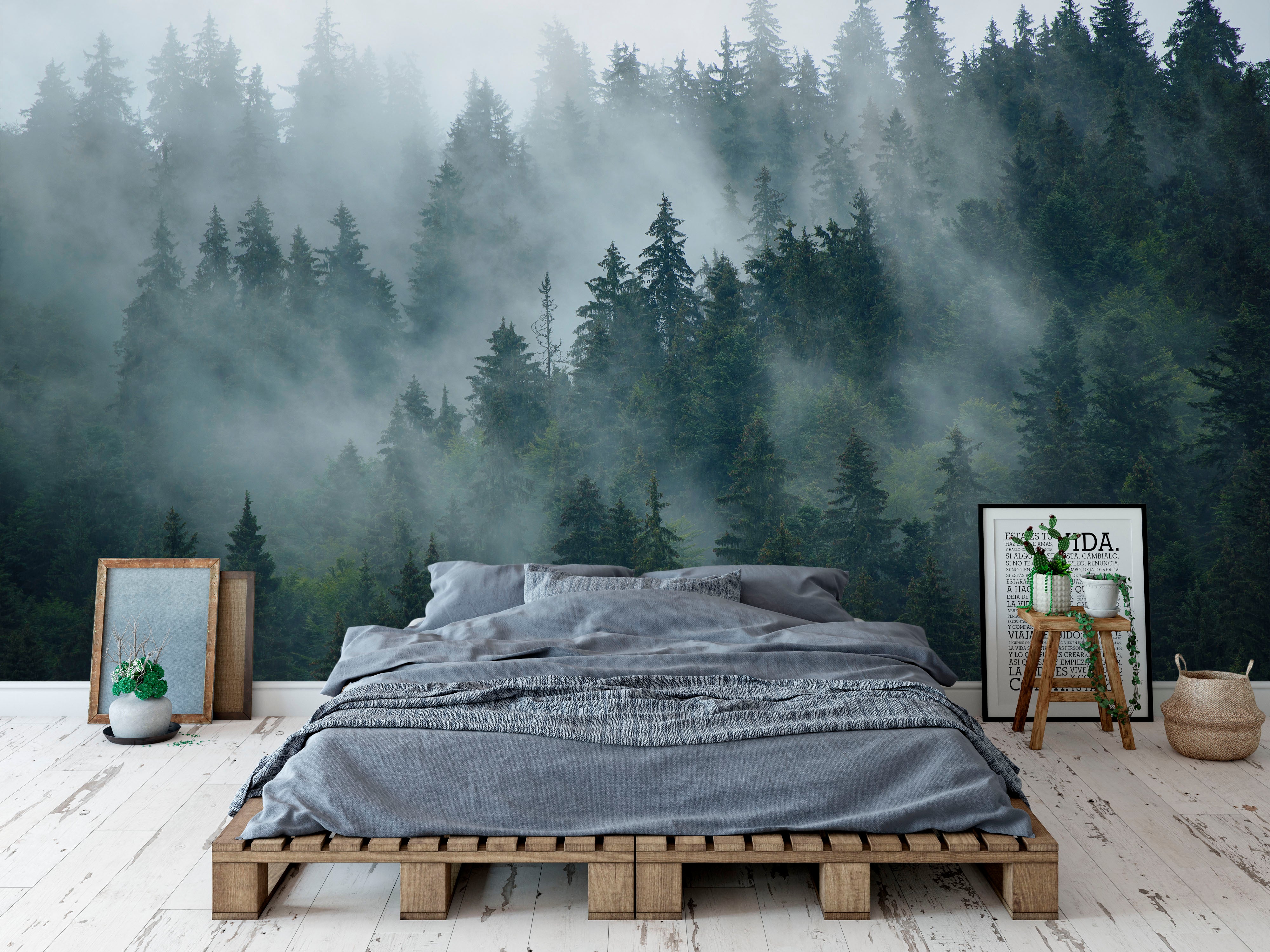 Mural depicting a dense evergreen forest shrouded in atmospheric gray mist.