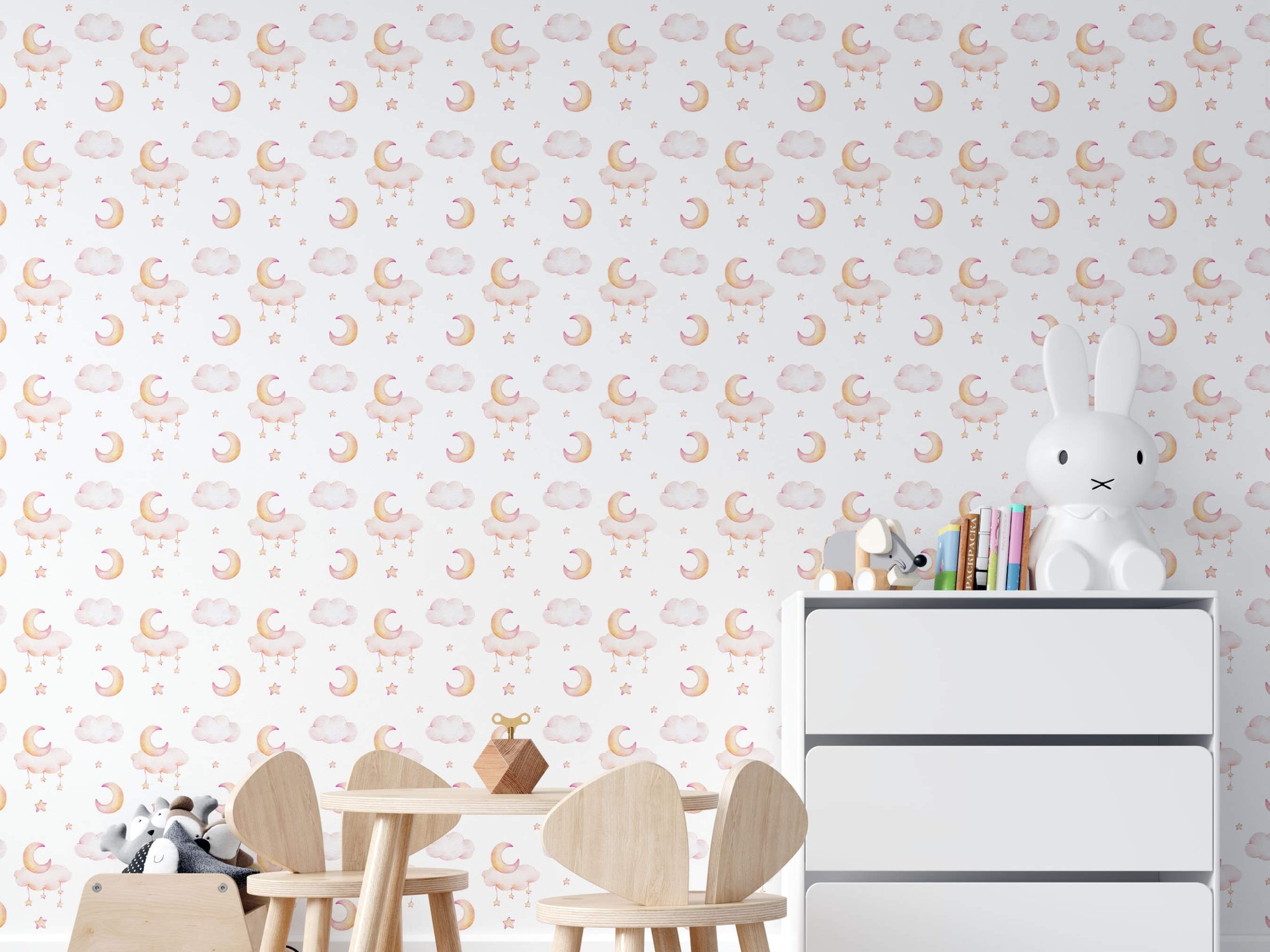 Watercolor wallpaper with soft pink and yellow crescent moons, clouds, and stars scattered across a white background.