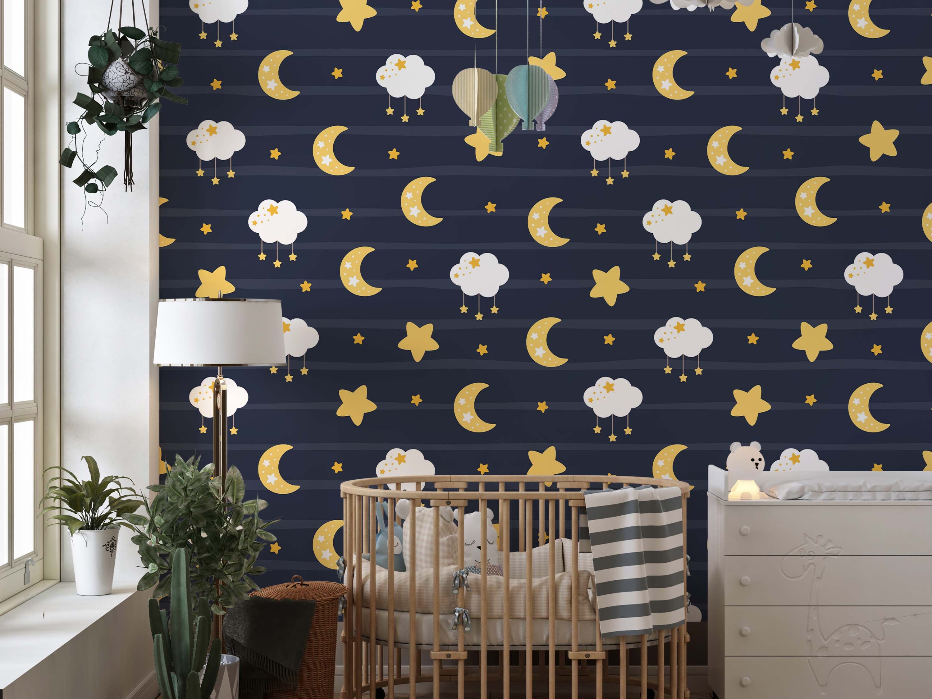 Dark blue striped wallpaper with yellow crescent moons, stars, and white clouds with small hanging stars.