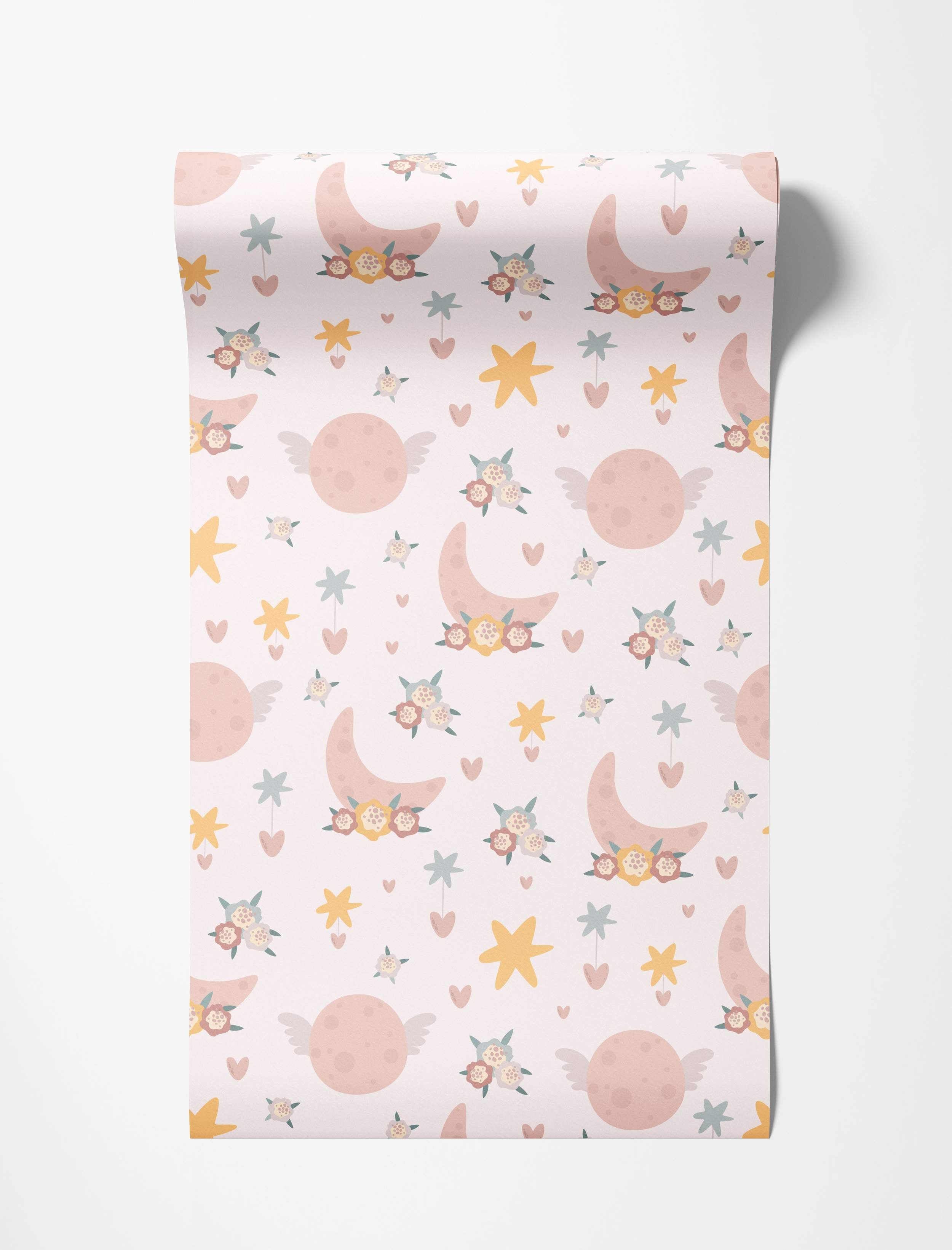 Whimsical wallpaper with pastel pink floral moons, winged planets, stars, and hearts in pink, yellow, and blue on a light background.