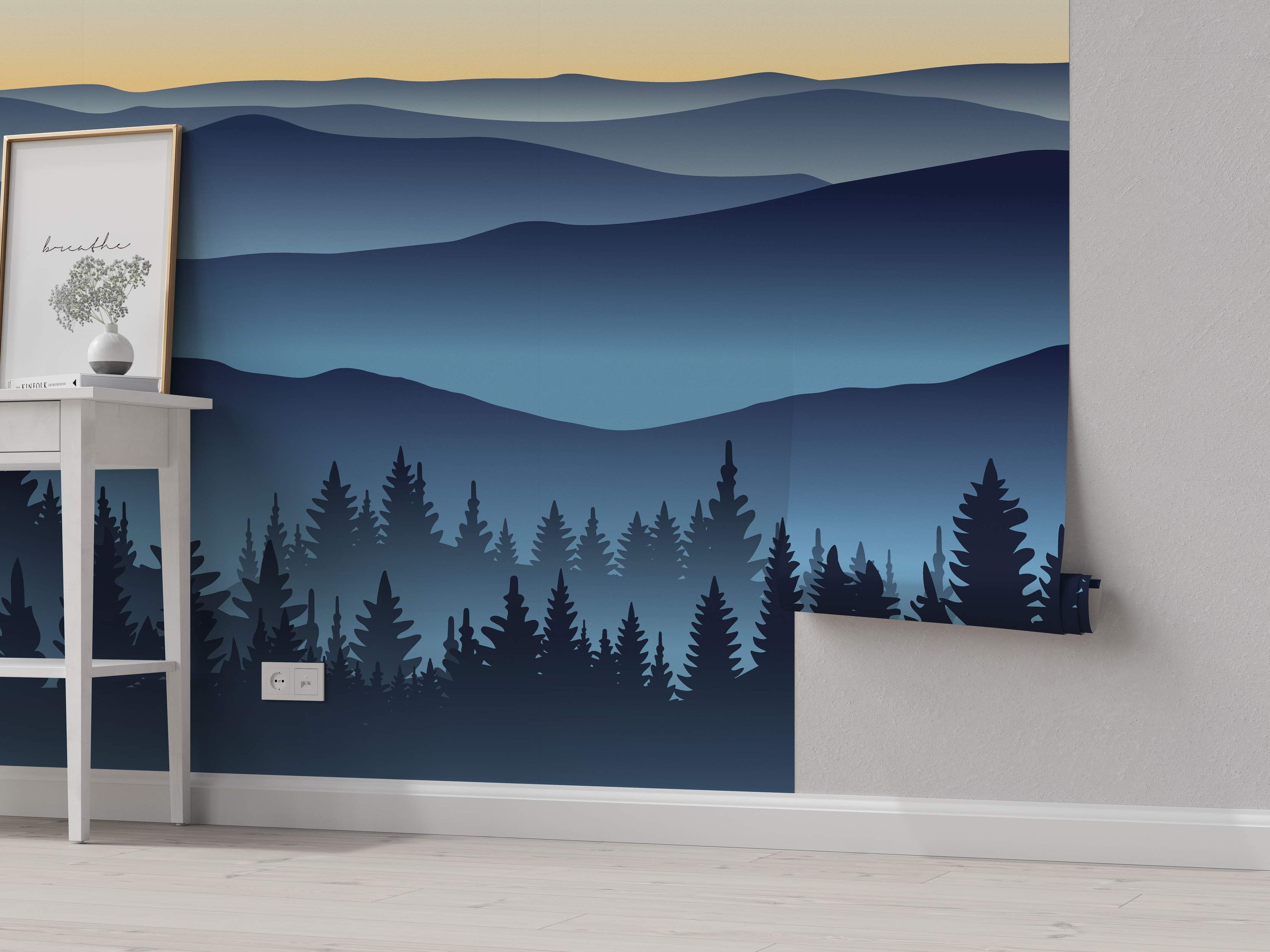 Stylized landscape mural with layered blue mountains, a dark blue pine forest silhouette, and a pale yellow to blue gradient sky.