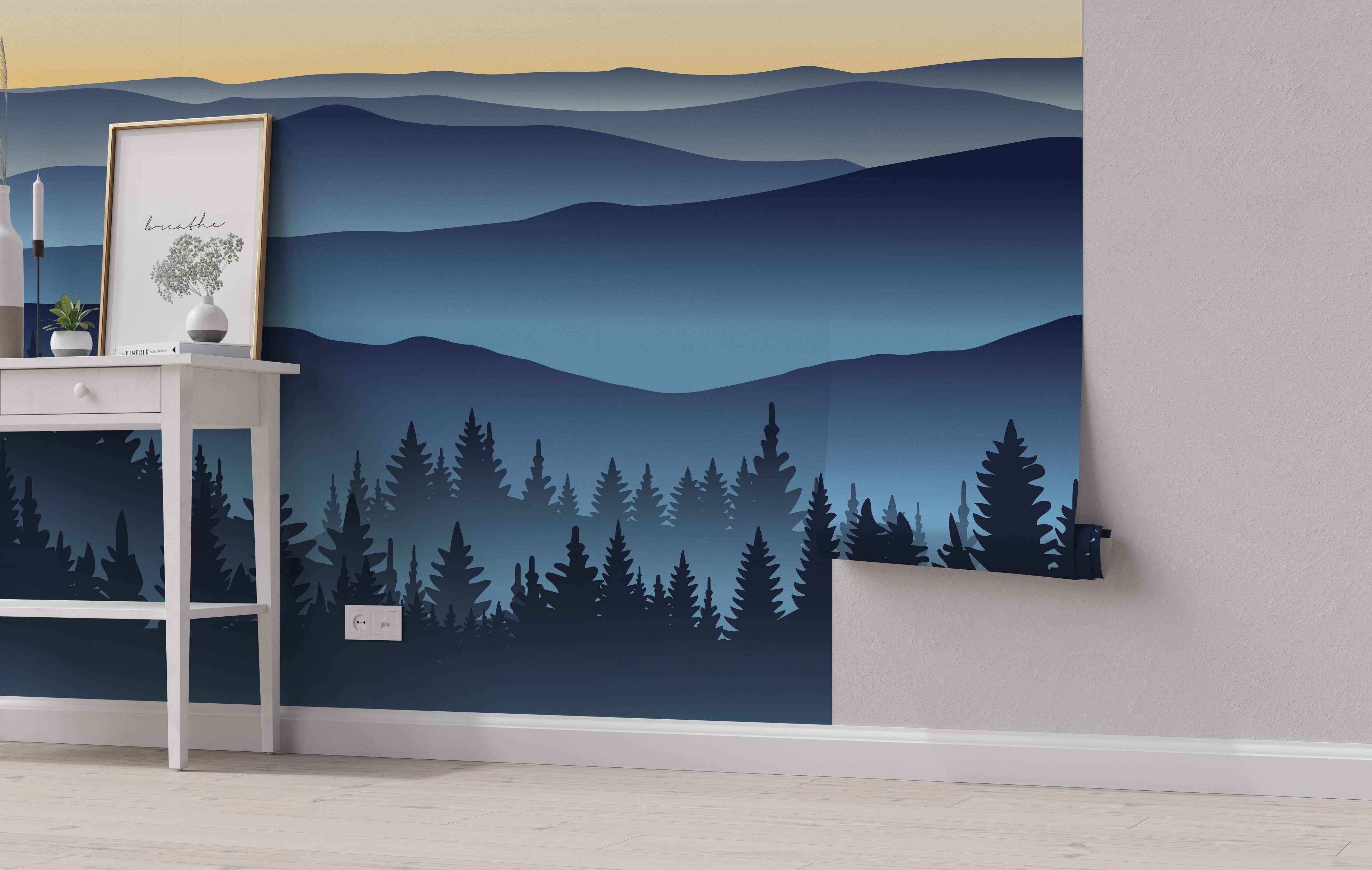 Stylized landscape mural with layered blue mountains, a dark blue pine forest silhouette, and a pale yellow to blue gradient sky.