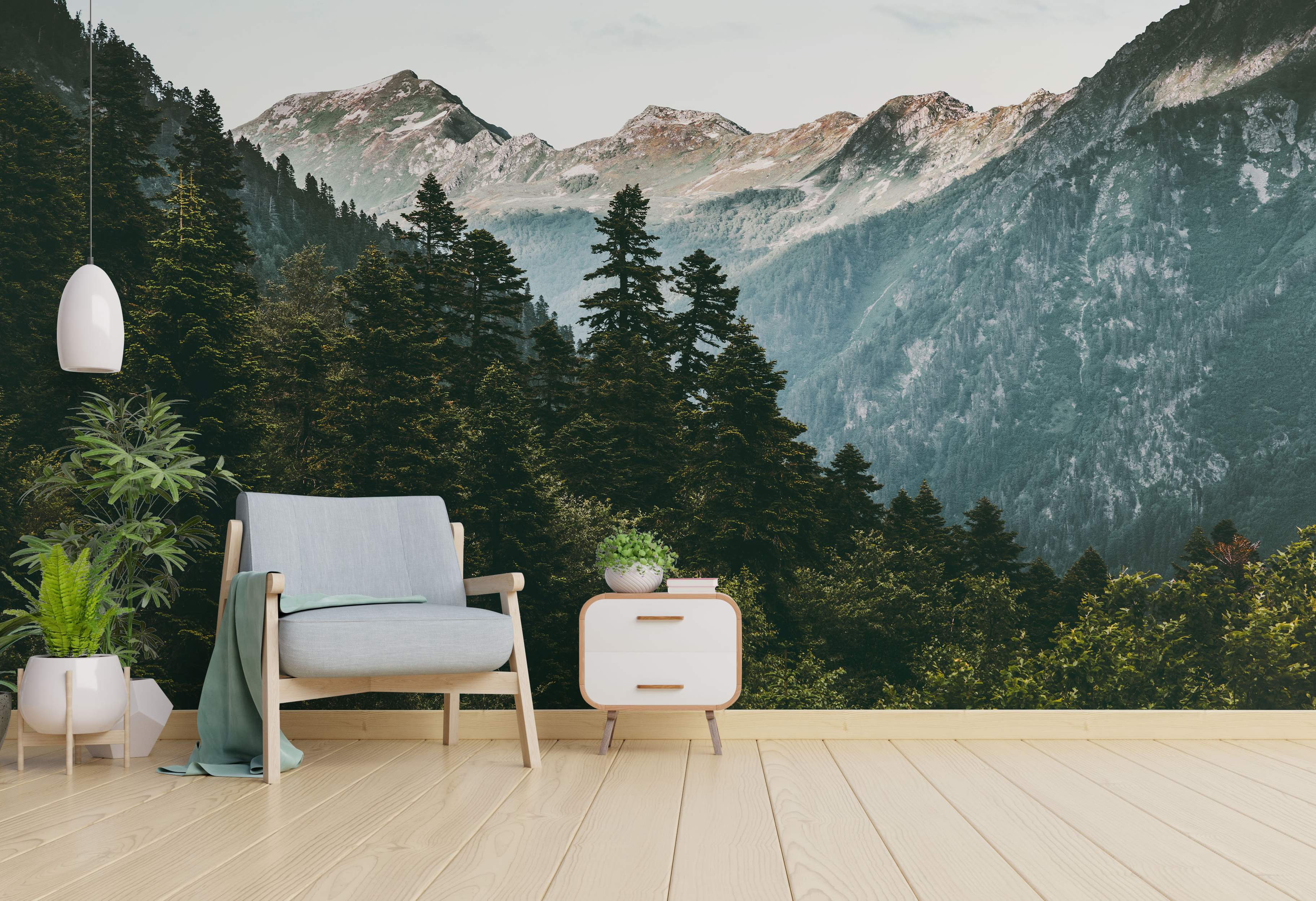Photorealistic mountain landscape mural with green pine forests below rugged gray peaks partially covered in snow.