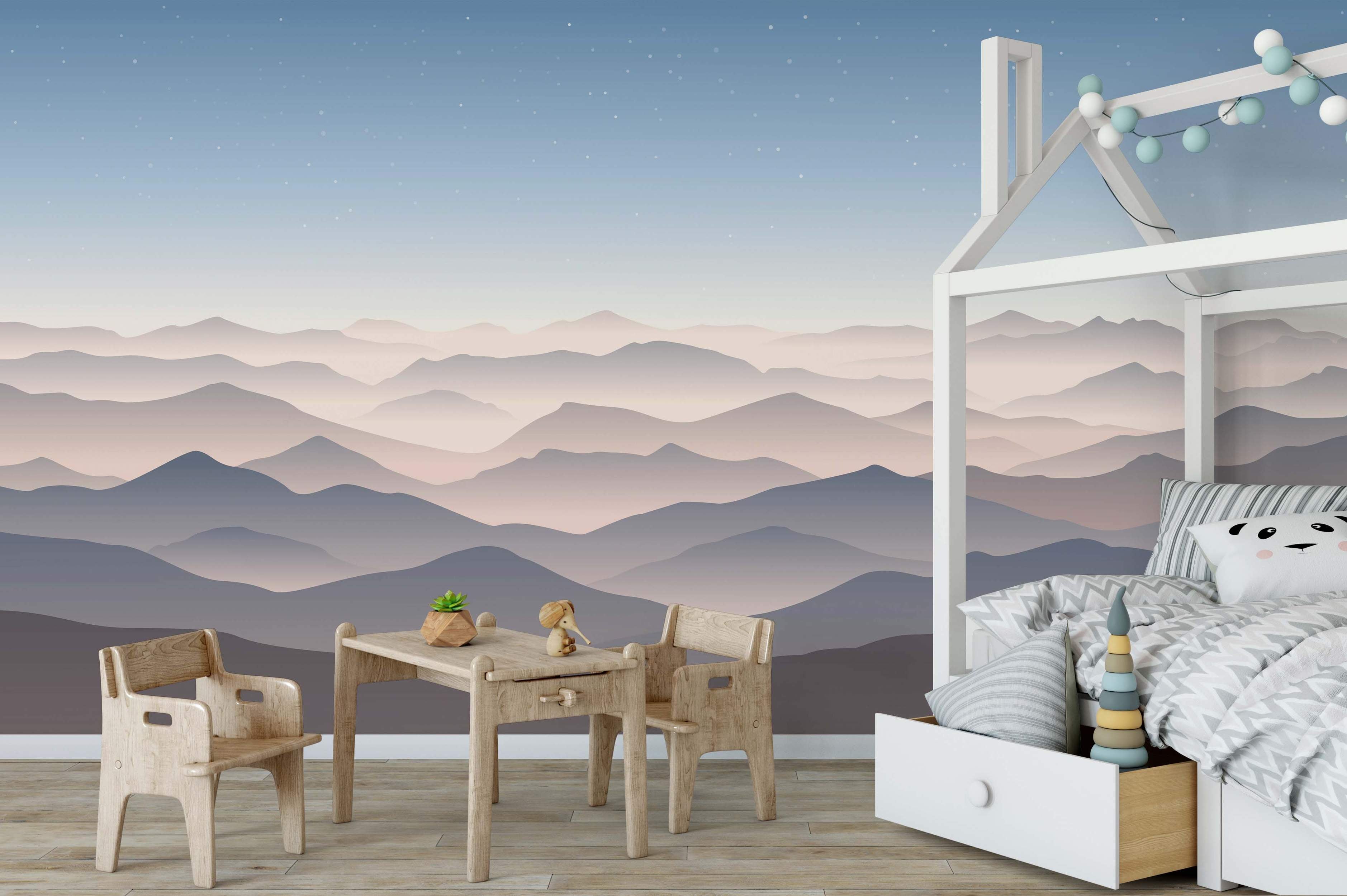 Mural featuring layered mountains in muted gray, pink, and purple hues beneath a starry blue gradient sky.