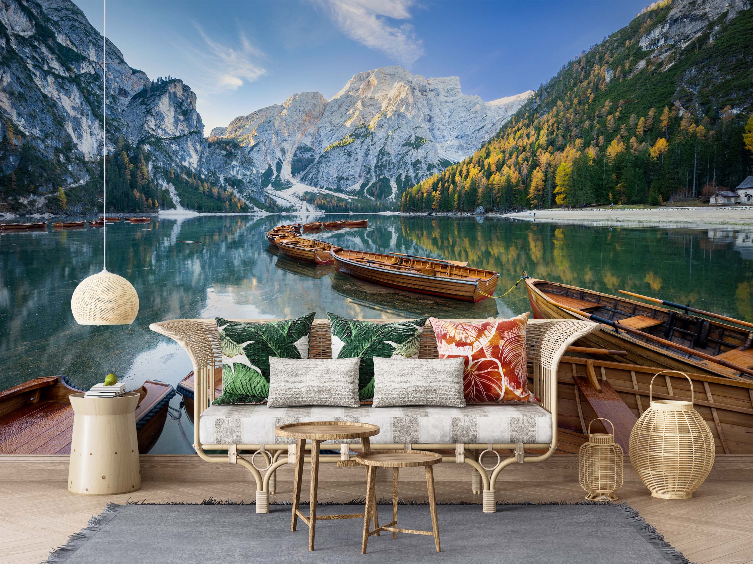 A photographic mural of a serene mountain lake with wooden boats, surrounded by rocky peaks and an autumn forest under a blue sky.