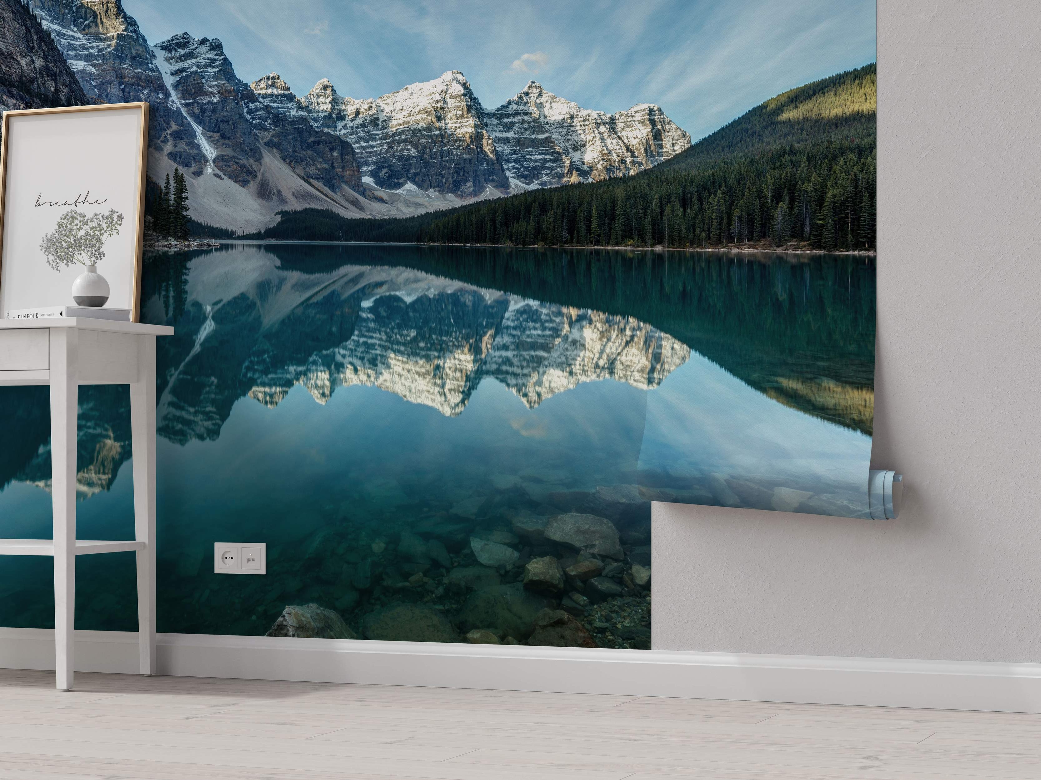 Photographic mural showing snow-capped mountains and forest reflecting perfectly in a clear turquoise lake.