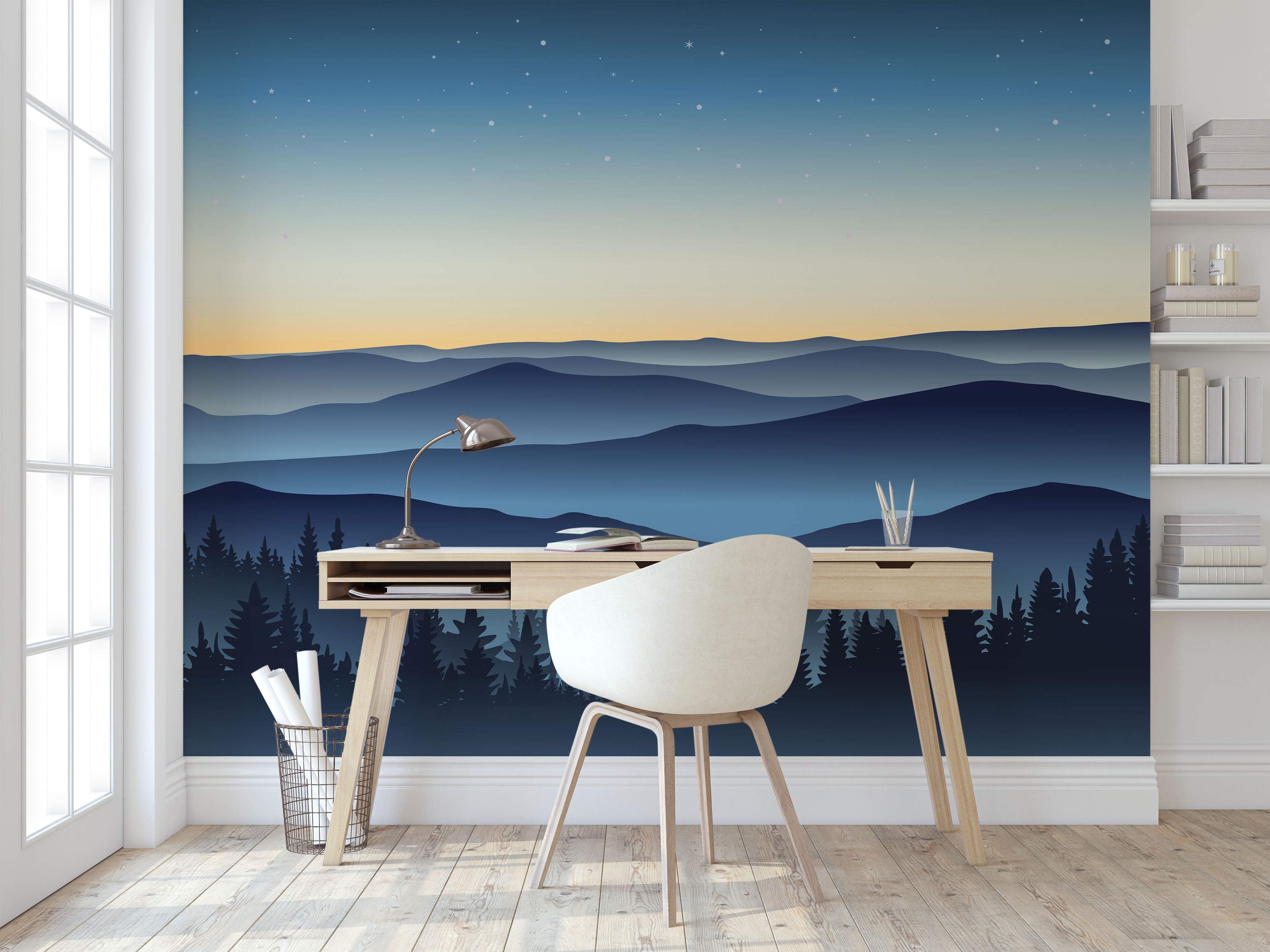 Mural of layered blue mountain silhouettes under a starry blue-to-yellow gradient sky with dark pine tree silhouettes.