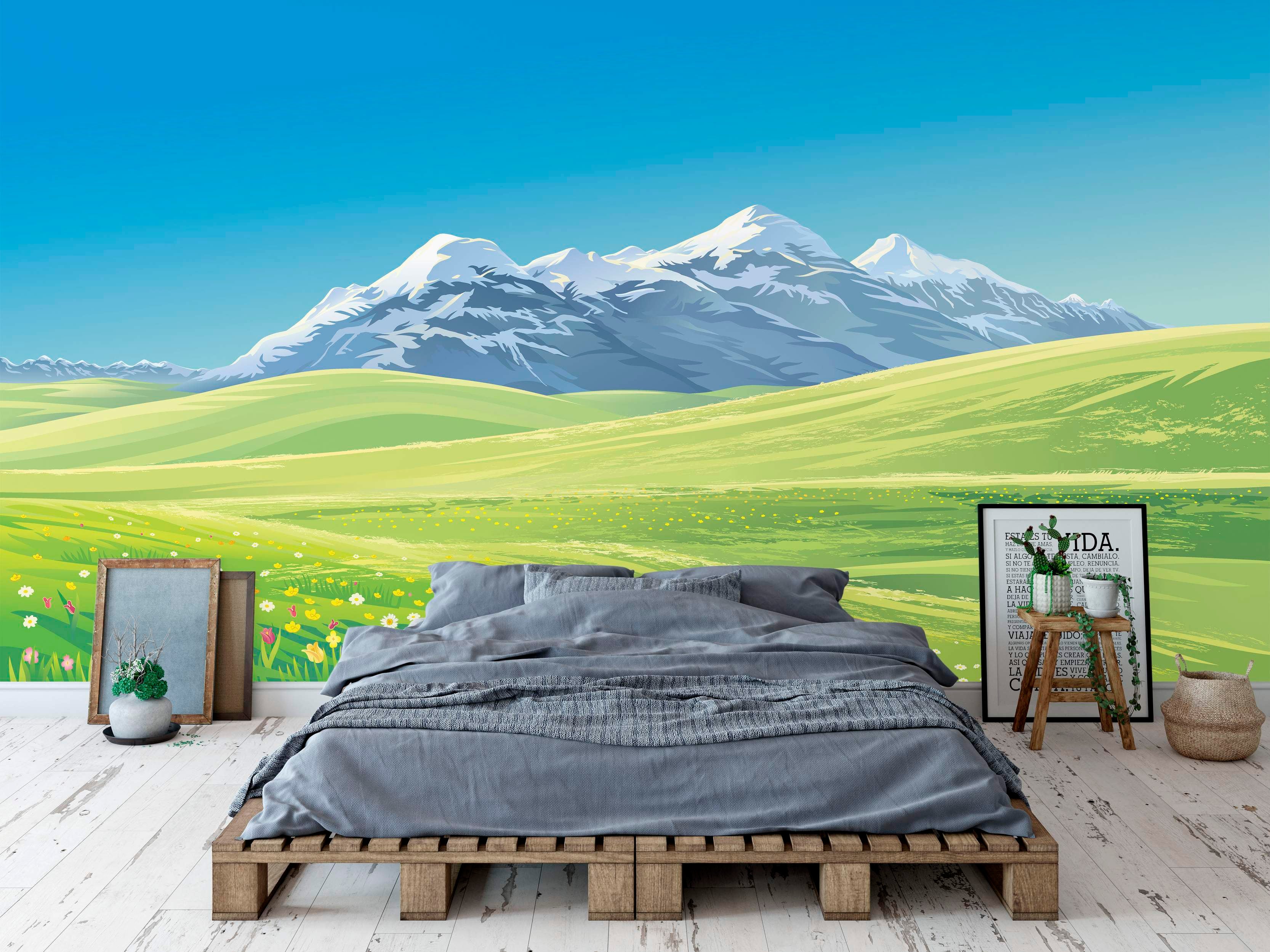 Scenic landscape mural featuring snow-capped mountains under a bright blue sky, overlooking vibrant green rolling hills.