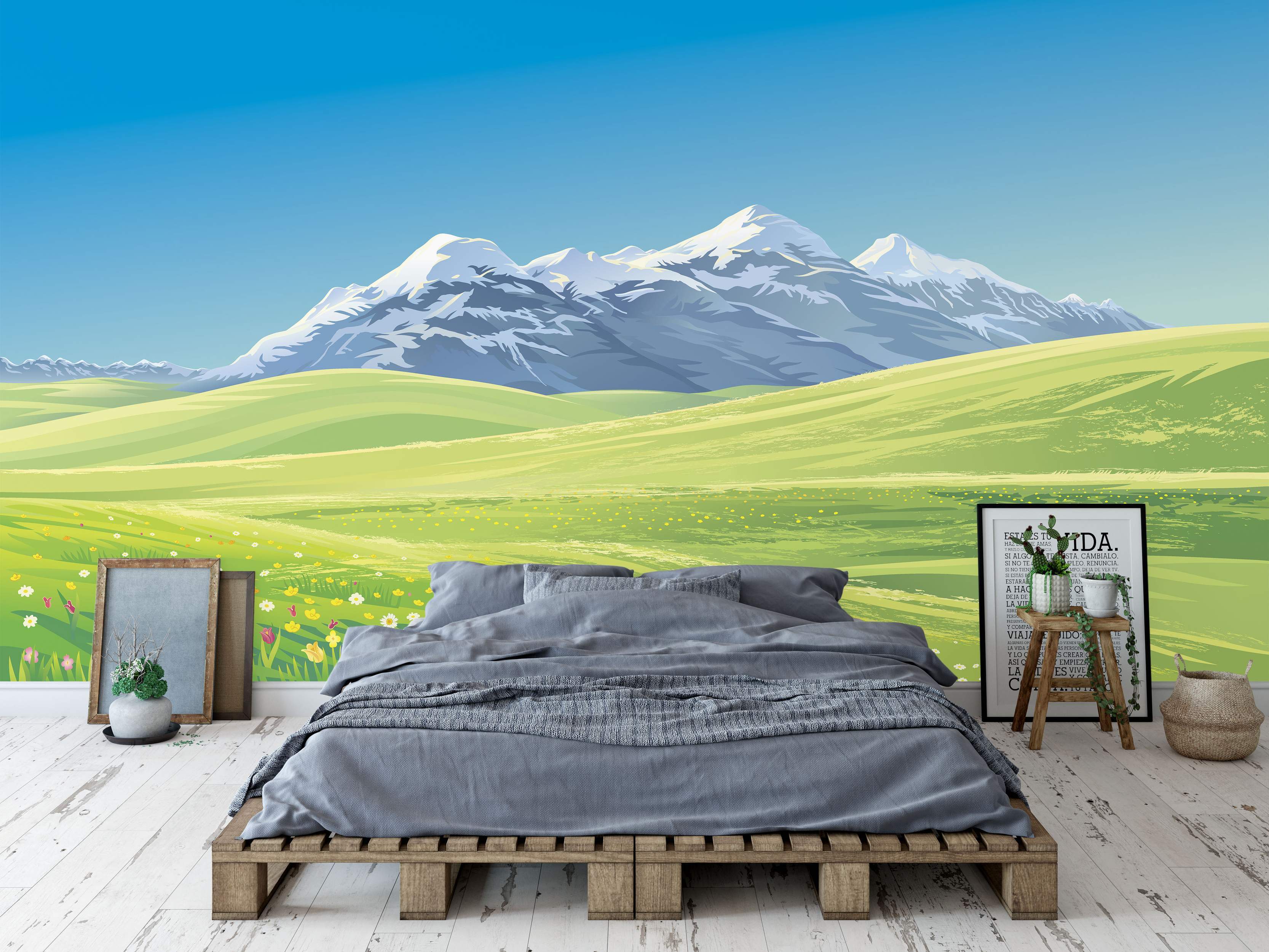 Scenic landscape mural featuring snow-capped mountains under a bright blue sky, overlooking vibrant green rolling hills.
