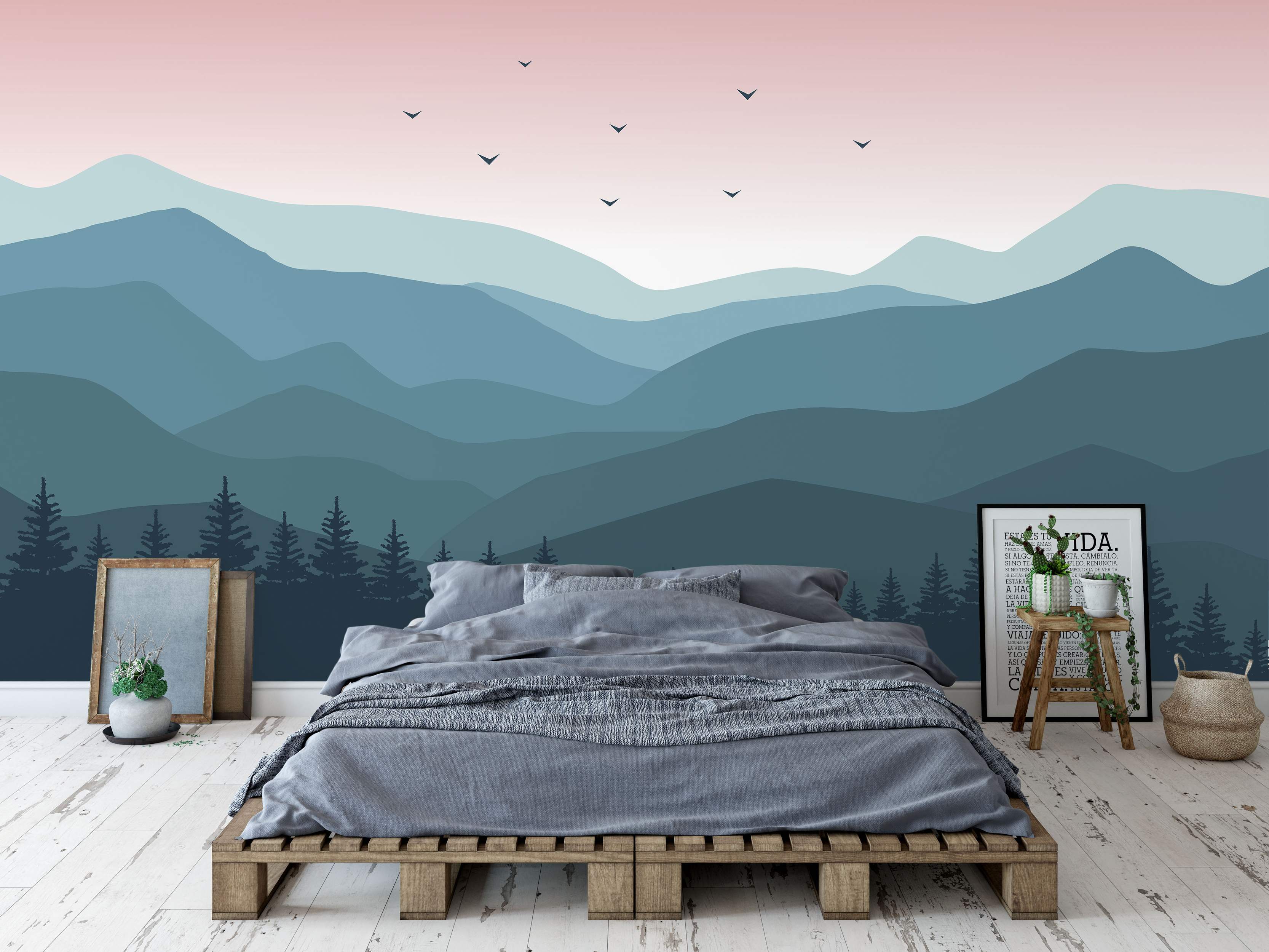 Stylized mountain landscape mural featuring layered teal and blue hills under a soft pink sky with flying bird silhouettes.