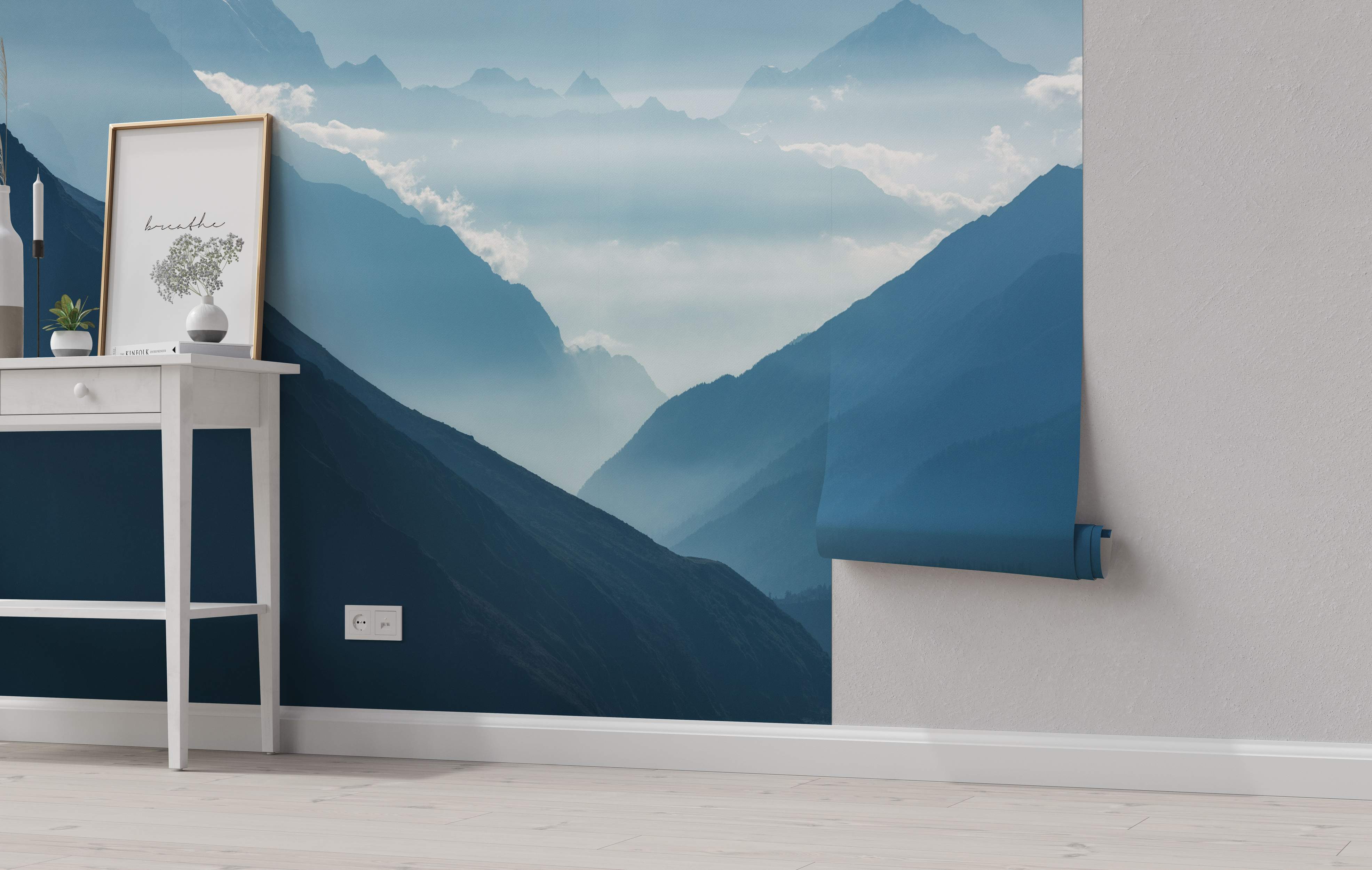 Photorealistic mural of hazy blue mountain ranges receding into a misty sky with soft clouds.