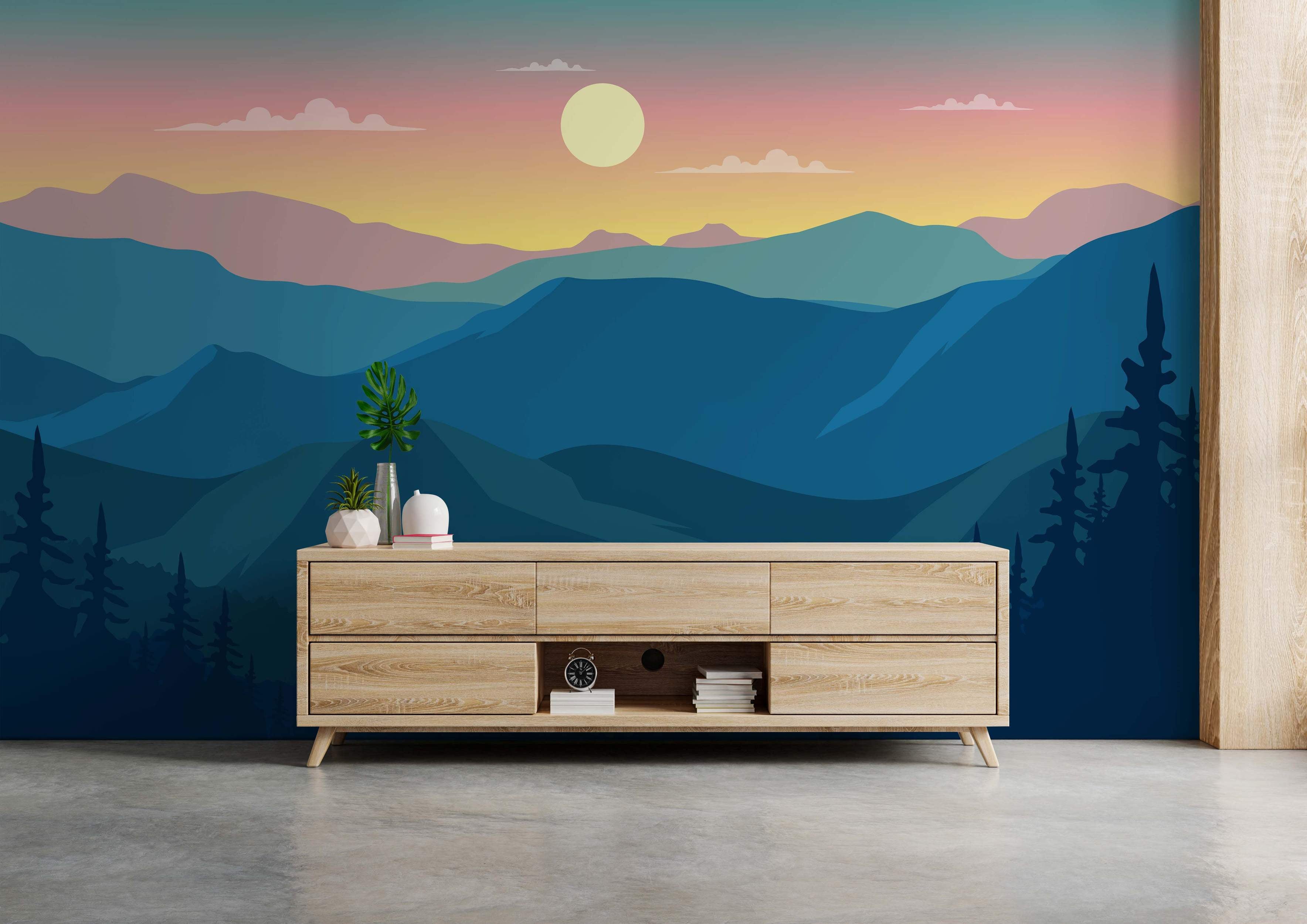 Calm mountain landscape mural featuring blue ridges, silhouetted trees, and a pink/yellow sky with a sun.