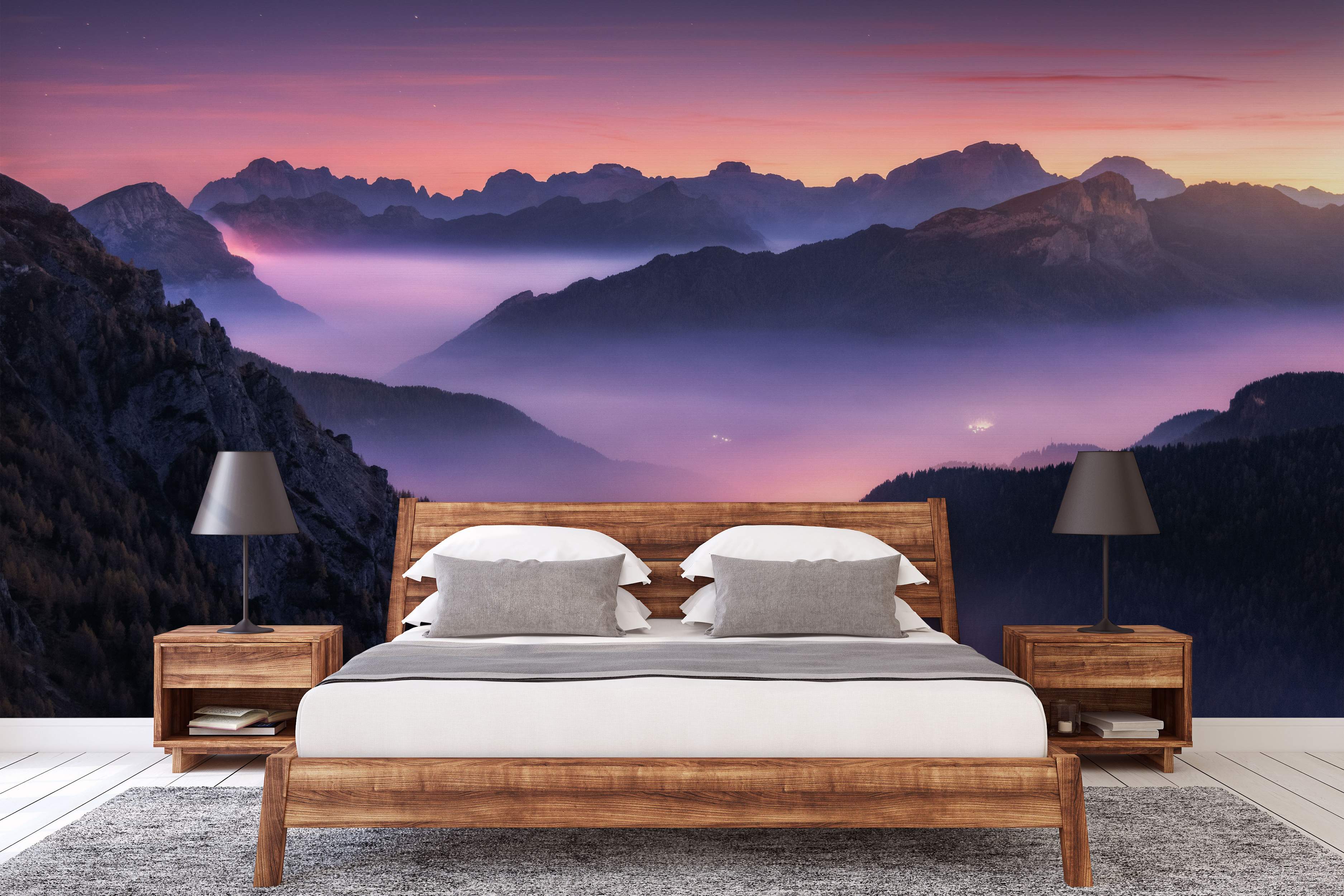 Mural depicting a misty mountain range silhouette under a vibrant pink and purple twilight sky.