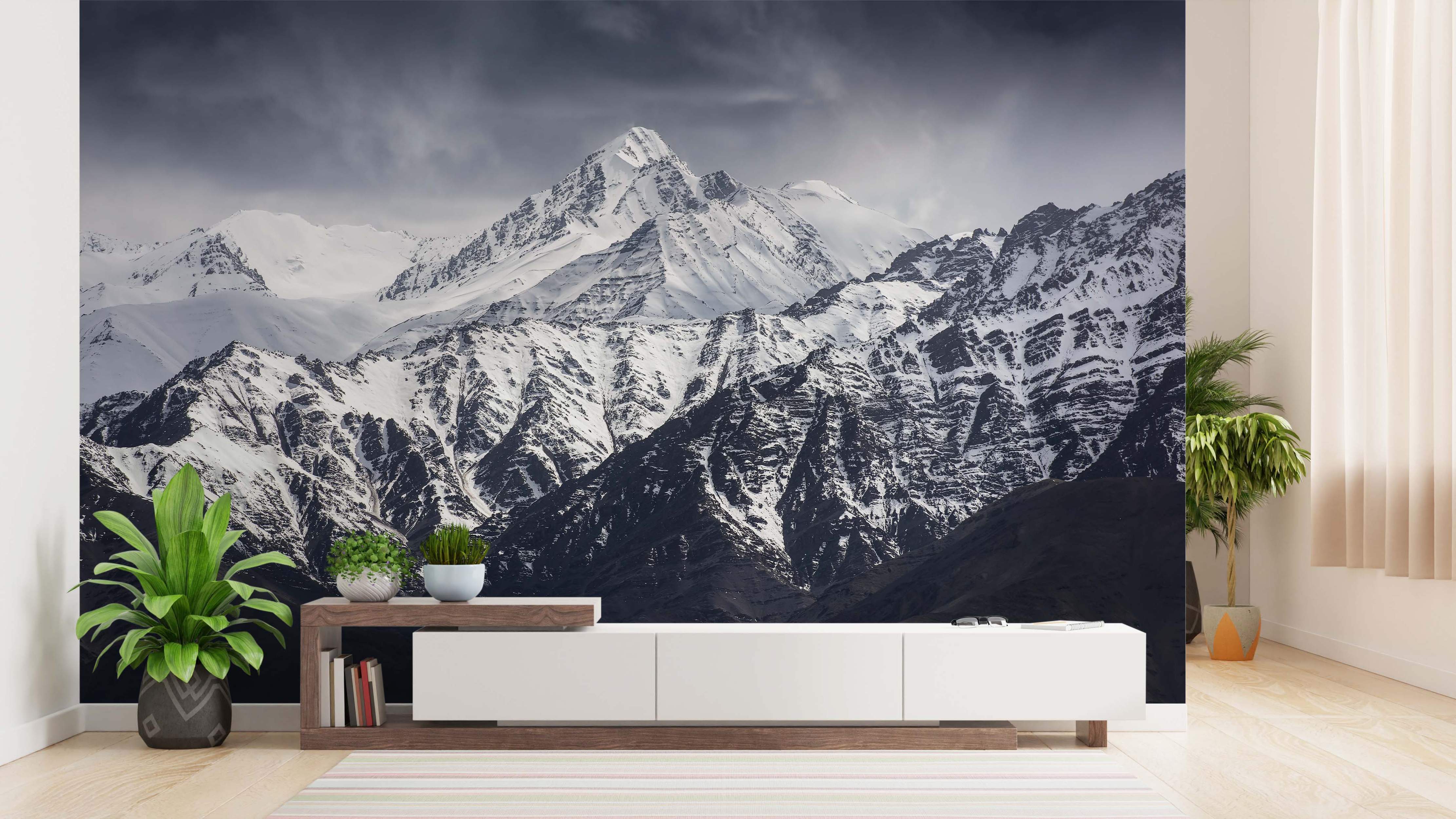 Photographic mural depicting majestic snow-capped mountains under a dramatic grey sky, featuring stark white snow and dark rock textures.
