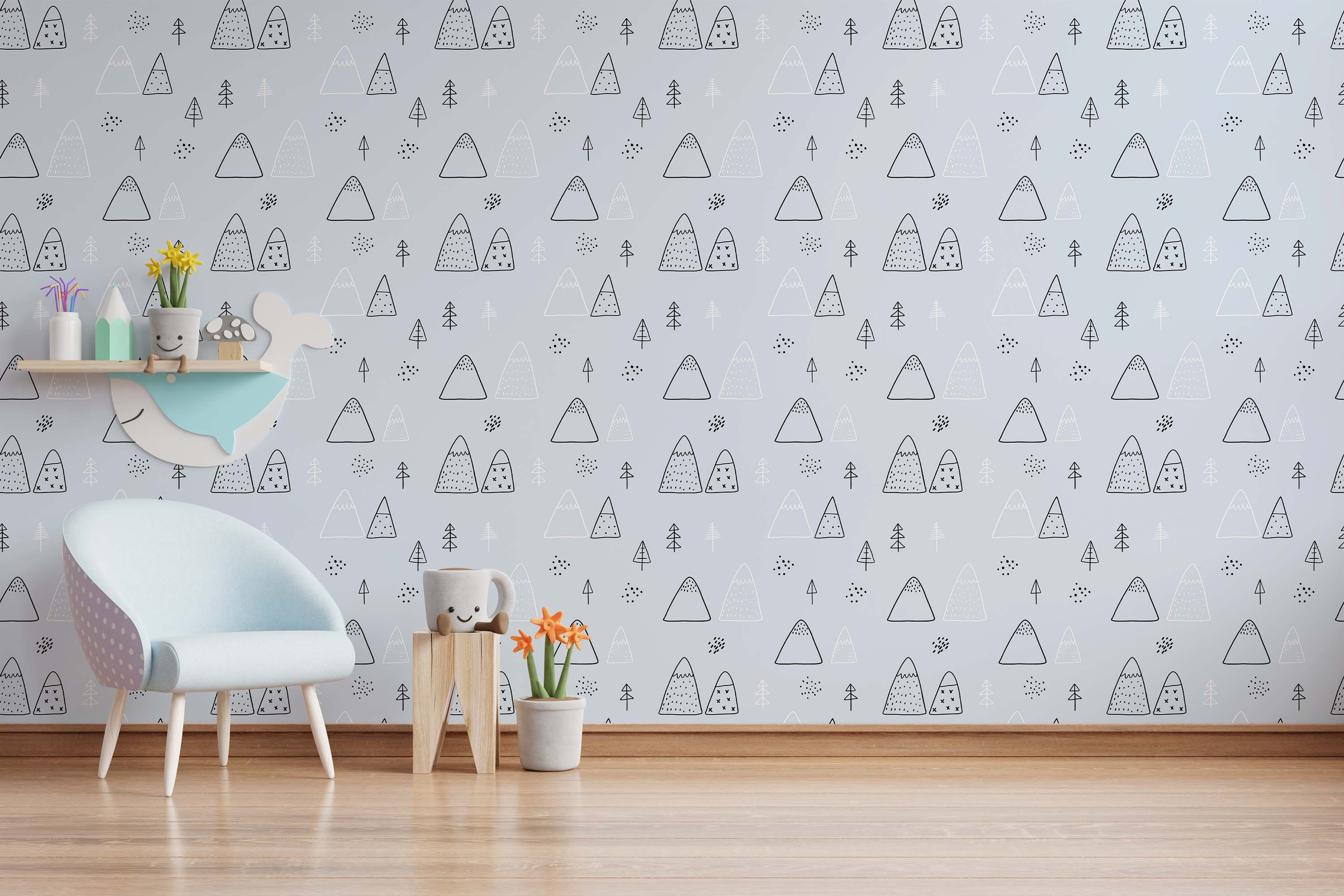Wallpaper with a repeating doodle pattern of black and white mountains and trees on a light blue background.