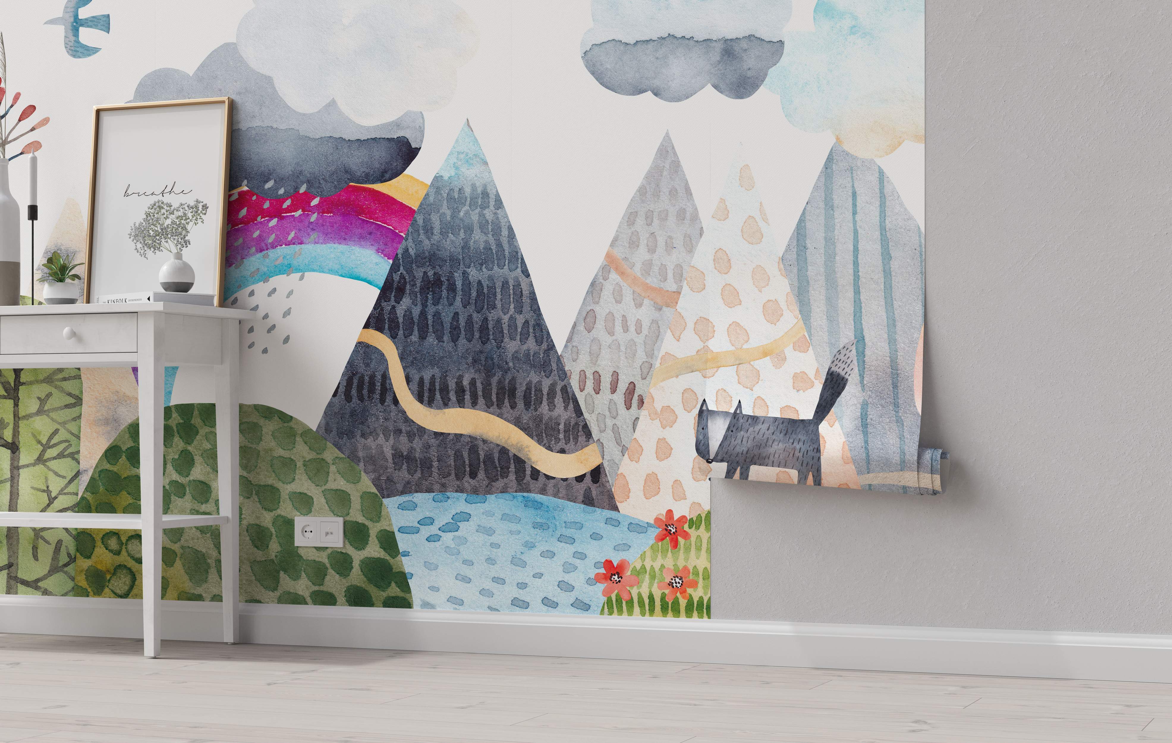 Whimsical watercolor mural featuring stylized mountains, clouds, a rainbow, a bird, and a fox in blues, grays, and greens.