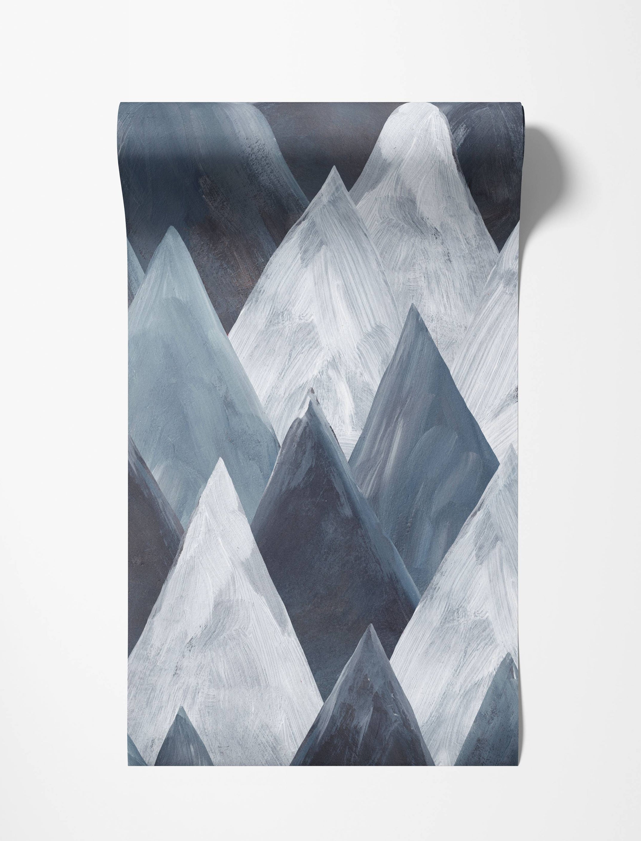Abstract geometric mountain wallpaper with a painterly texture in shades of blue, gray, and white.