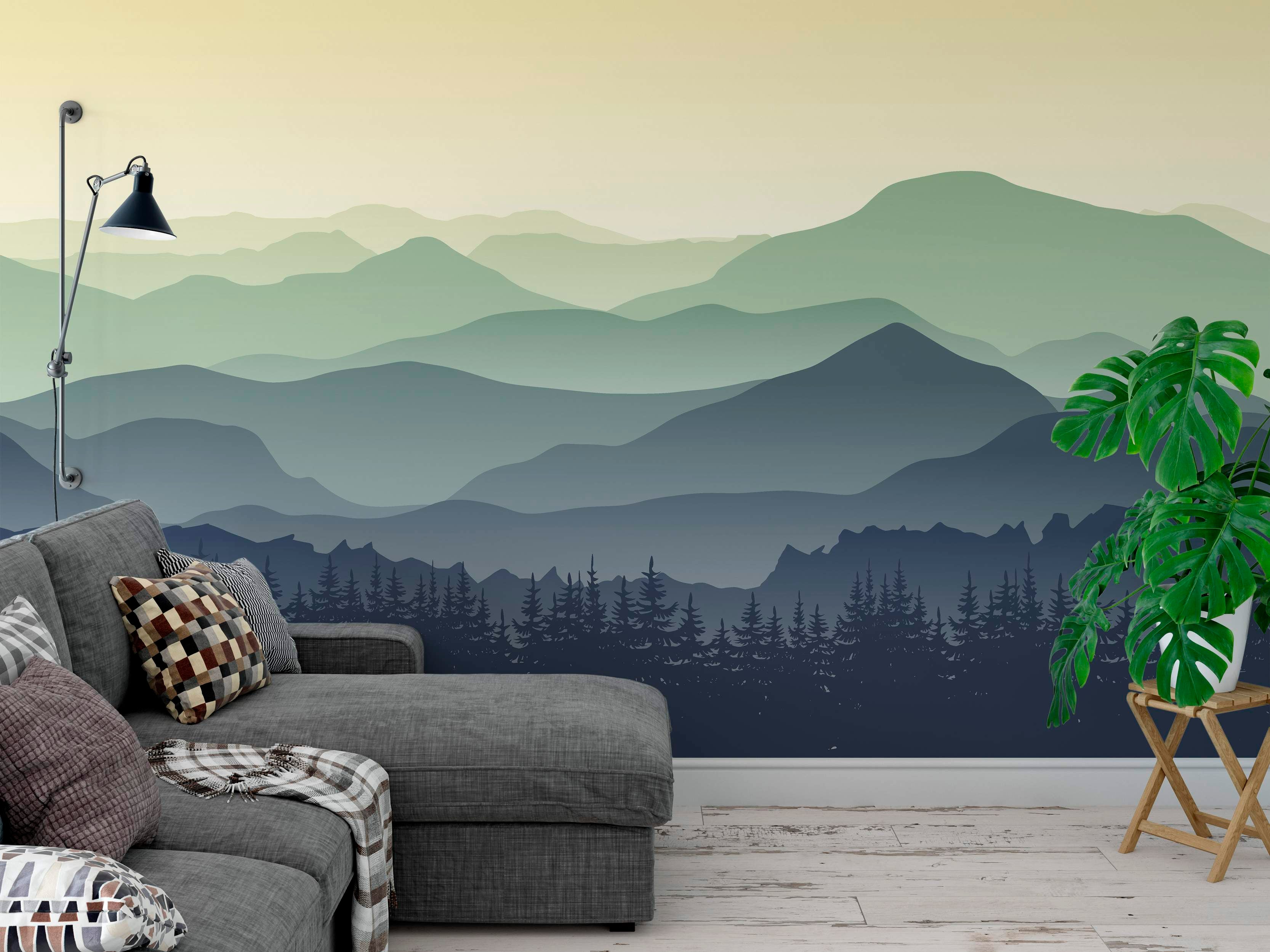 Mountain landscape mural with layered peaks fading from green to blue under a pale yellow sky, featuring a dark blue forest silhouette.