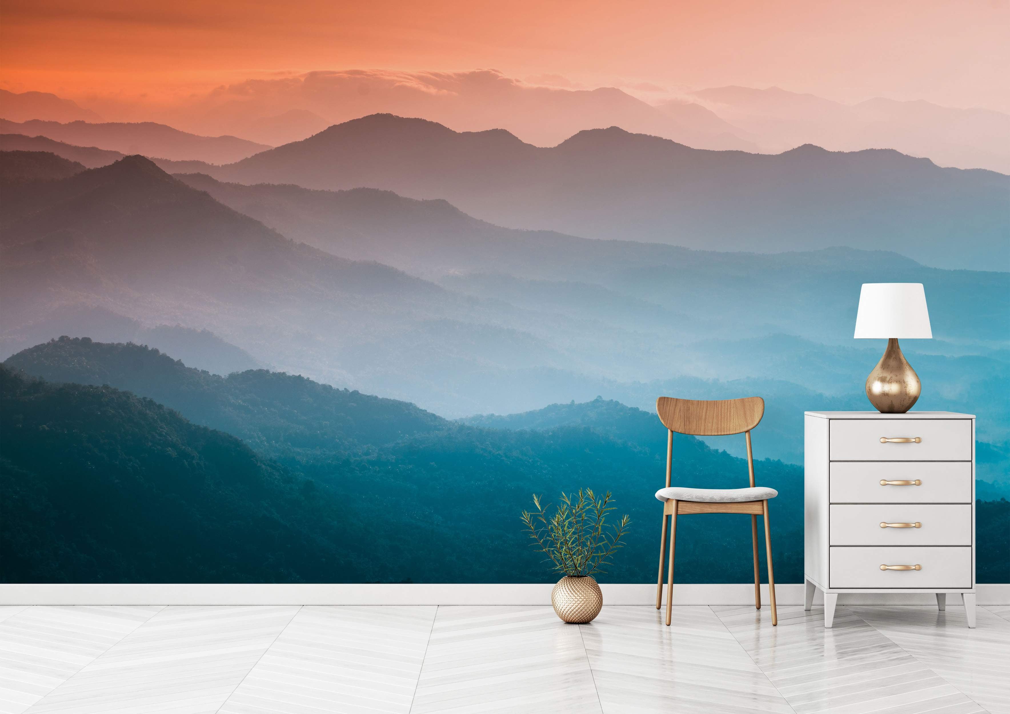 Mural depicting hazy mountain ranges fading into the distance under an orange-to-blue gradient sky.
