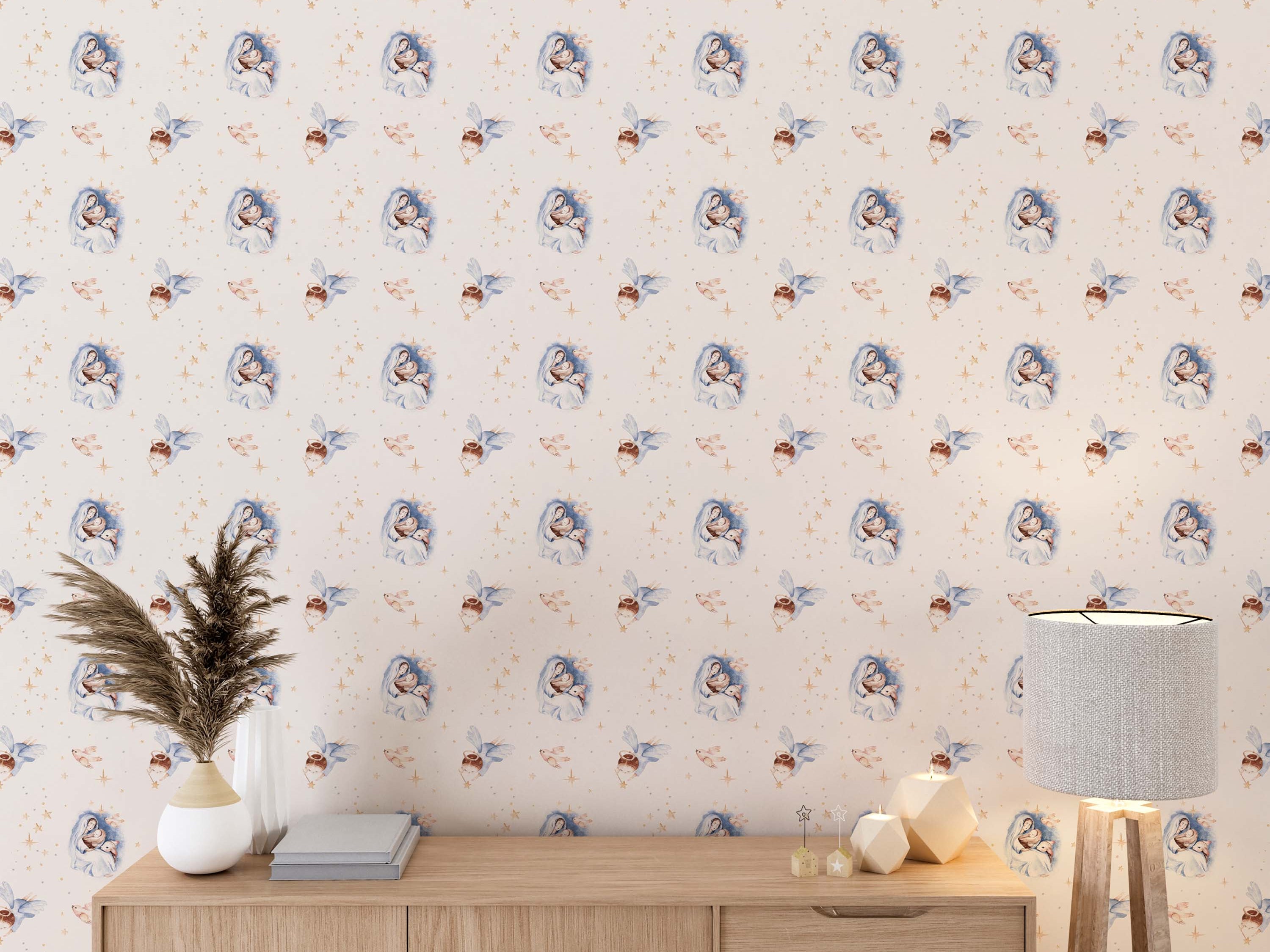 Wallpaper with a repeating watercolor design of Nativity scenes, angels, birds, and stars in soft blue, beige, and gold.