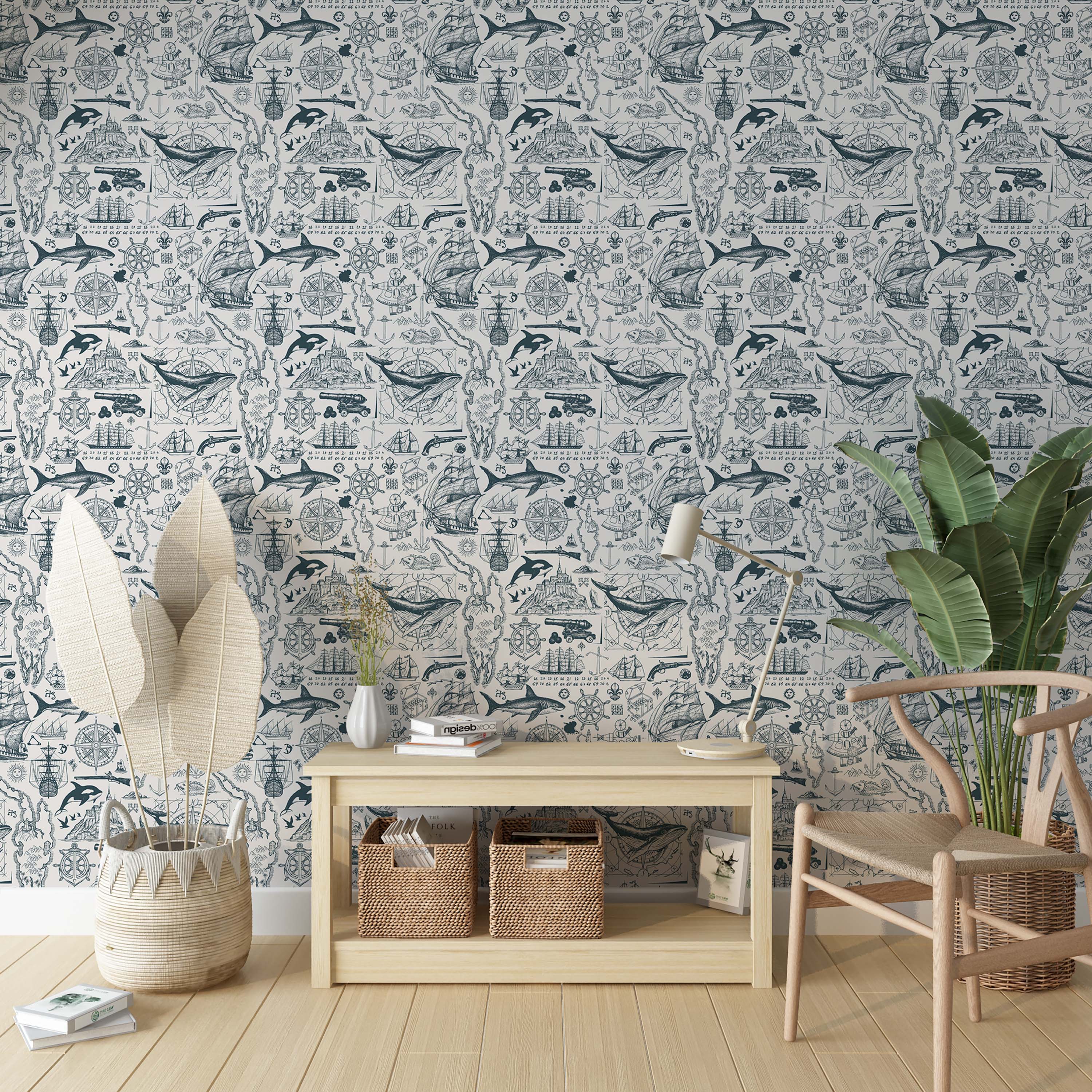 Illustrative nautical wallpaper with a repeating pattern of blue sketched ships, whales, compasses, and maps on an off-white background.